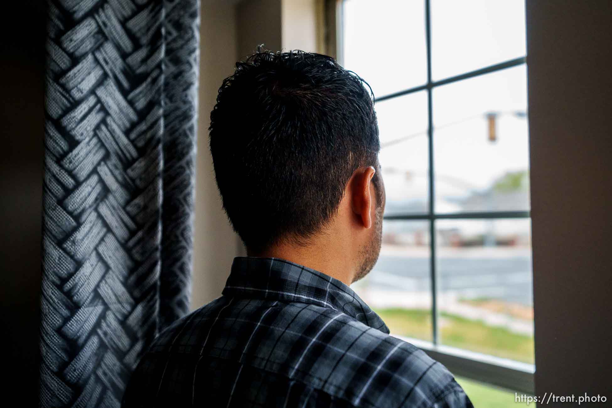 (Trent Nelson  |  The Salt Lake Tribune) Ahmad, an Afghan native who worked as an interpreter for the U.S. Army, at his West Valley City home on Tuesday, April 12, 2022.