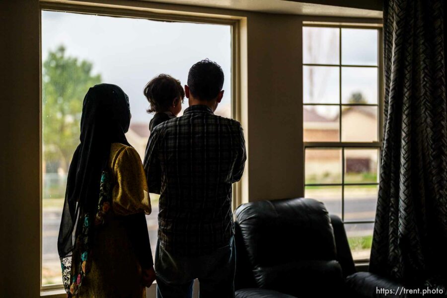 (Trent Nelson  |  The Salt Lake Tribune) Ahmad, an Afghan native who worked as an interpreter for the U.S. Army, with his wife Hosna and son Osman, in their West Valley City home on Tuesday, April 12, 2022.