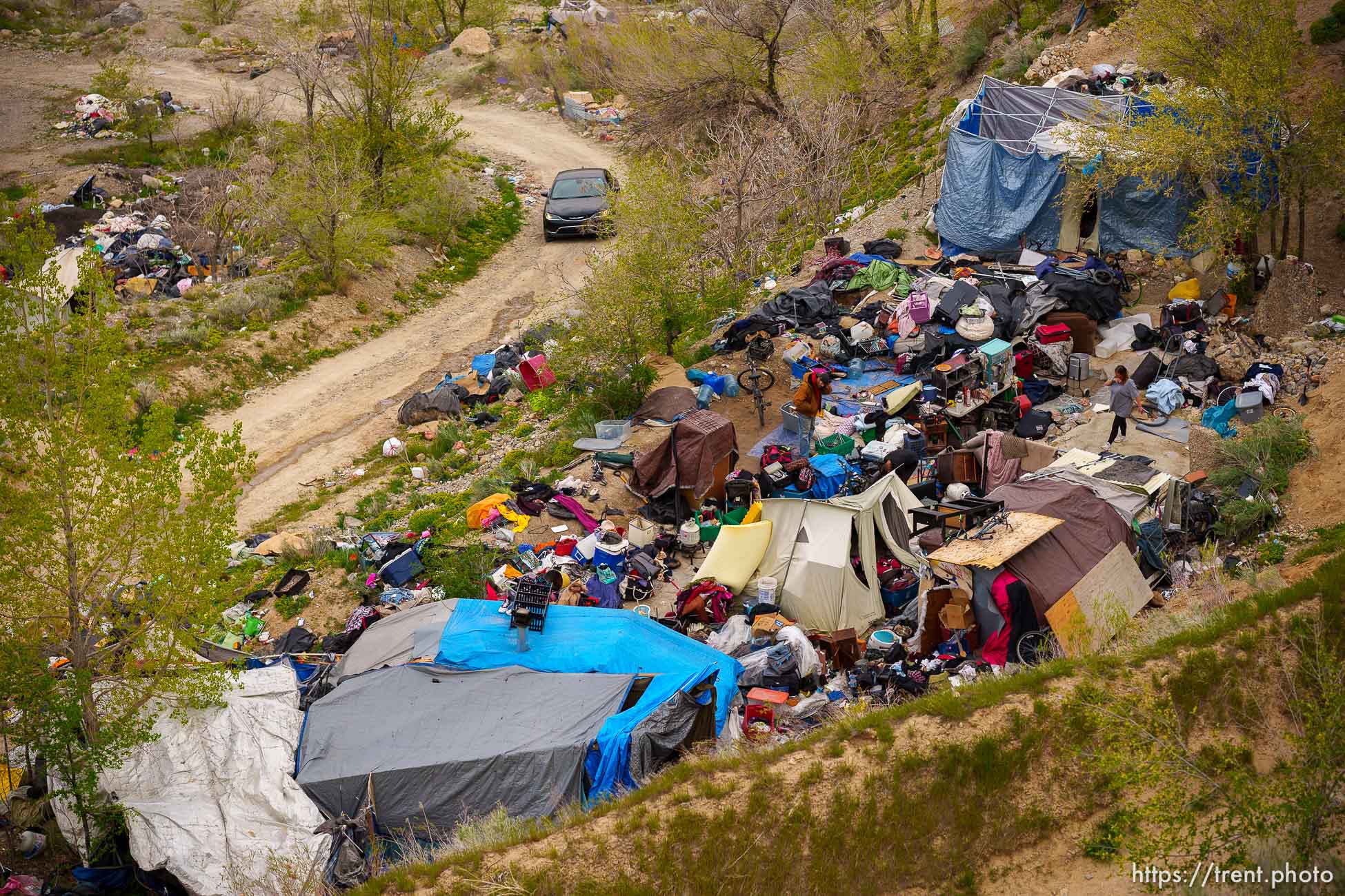 (Trent Nelson  |  The Salt Lake Tribune) The clearing of camps located east of Victory Road in the foothills north of Salt Lake City on Wednesday, April 27, 2022.