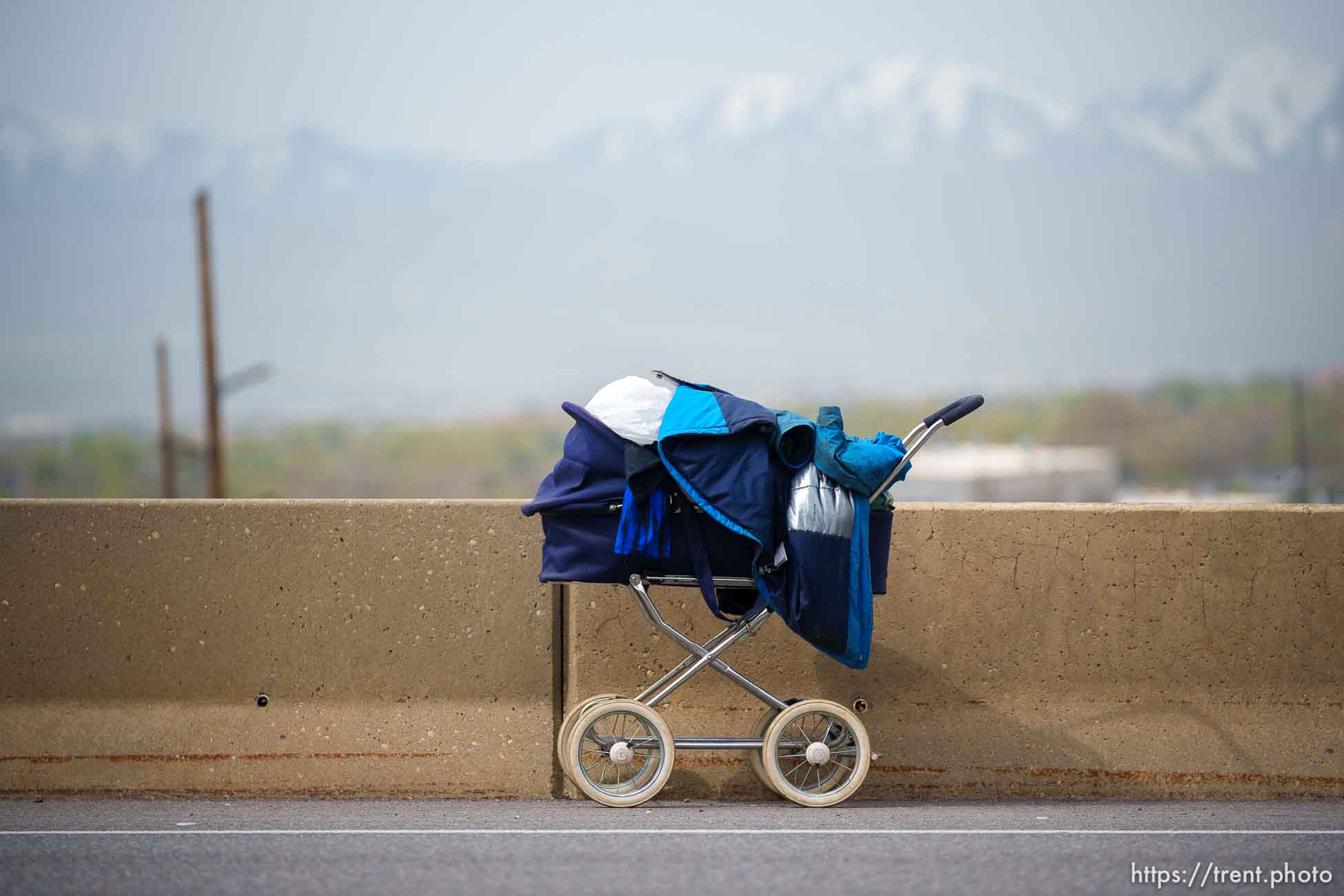 (Trent Nelson  |  The Salt Lake Tribune) A baby stroller the side of Victory Road road as camps are cleared in the foothills north of Salt Lake City on Wednesday, April 27, 2022.