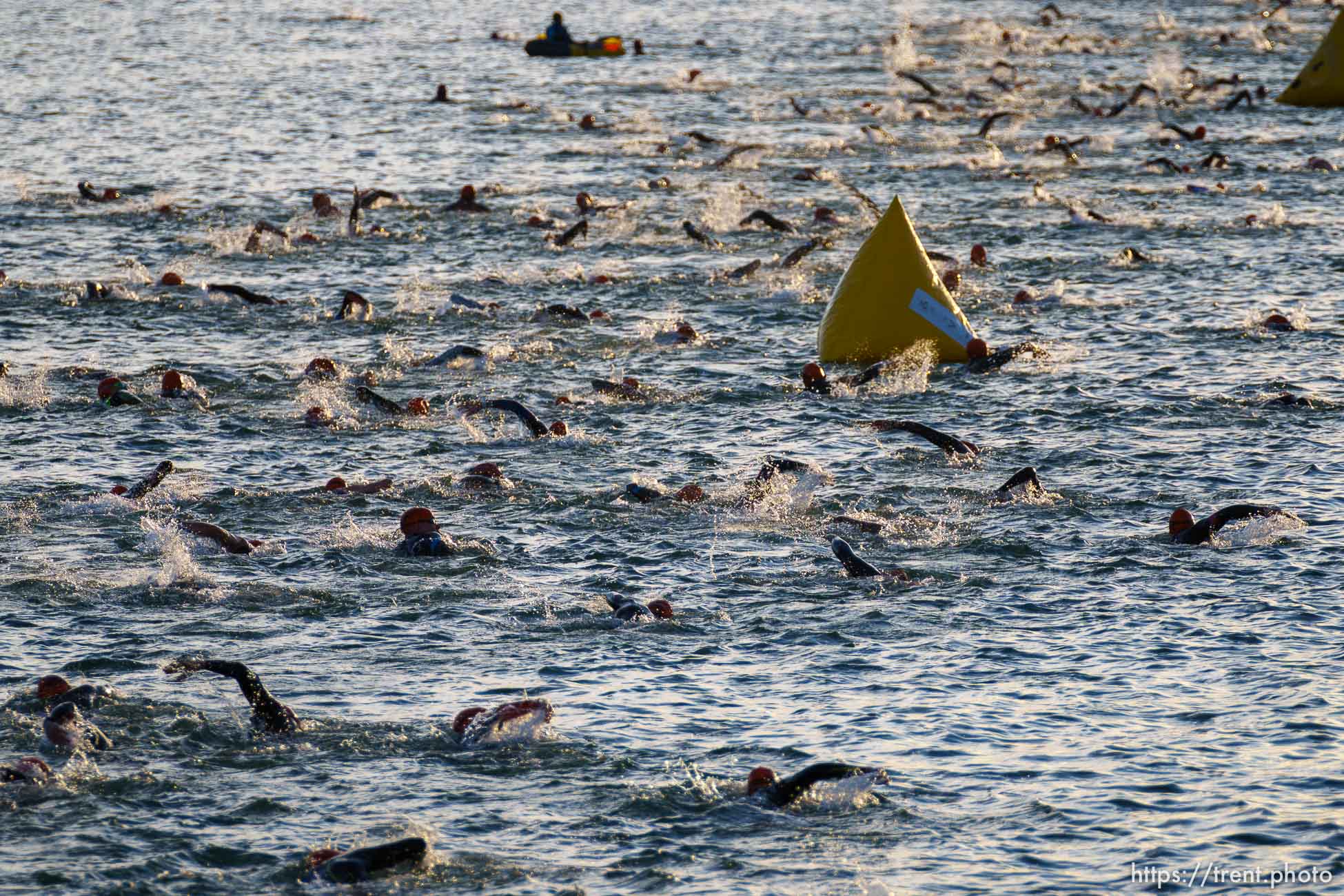 (Trent Nelson  |  The Salt Lake Tribune) Competitors swim at Sand Hollow Reservoir to start the Ironman World Championship triathlon in St. George on Saturday, May 7, 2022.