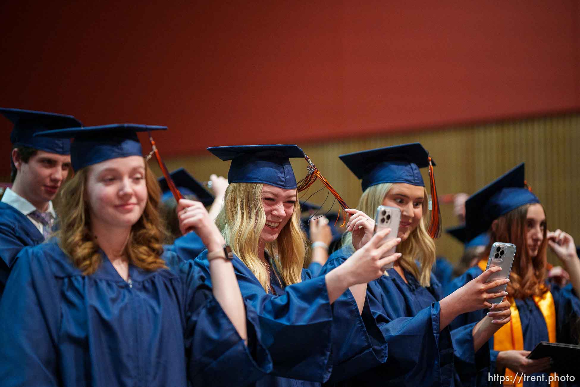 (Trent Nelson  |  The Salt Lake Tribune) Kings Peak High School students move their tassels at the end of commencement exercises at the virtual learning school in Bluffdale on Thursday, June 2, 2022. From left are Tessa Marty, Taylor DiAntonio, and Whitney Face.