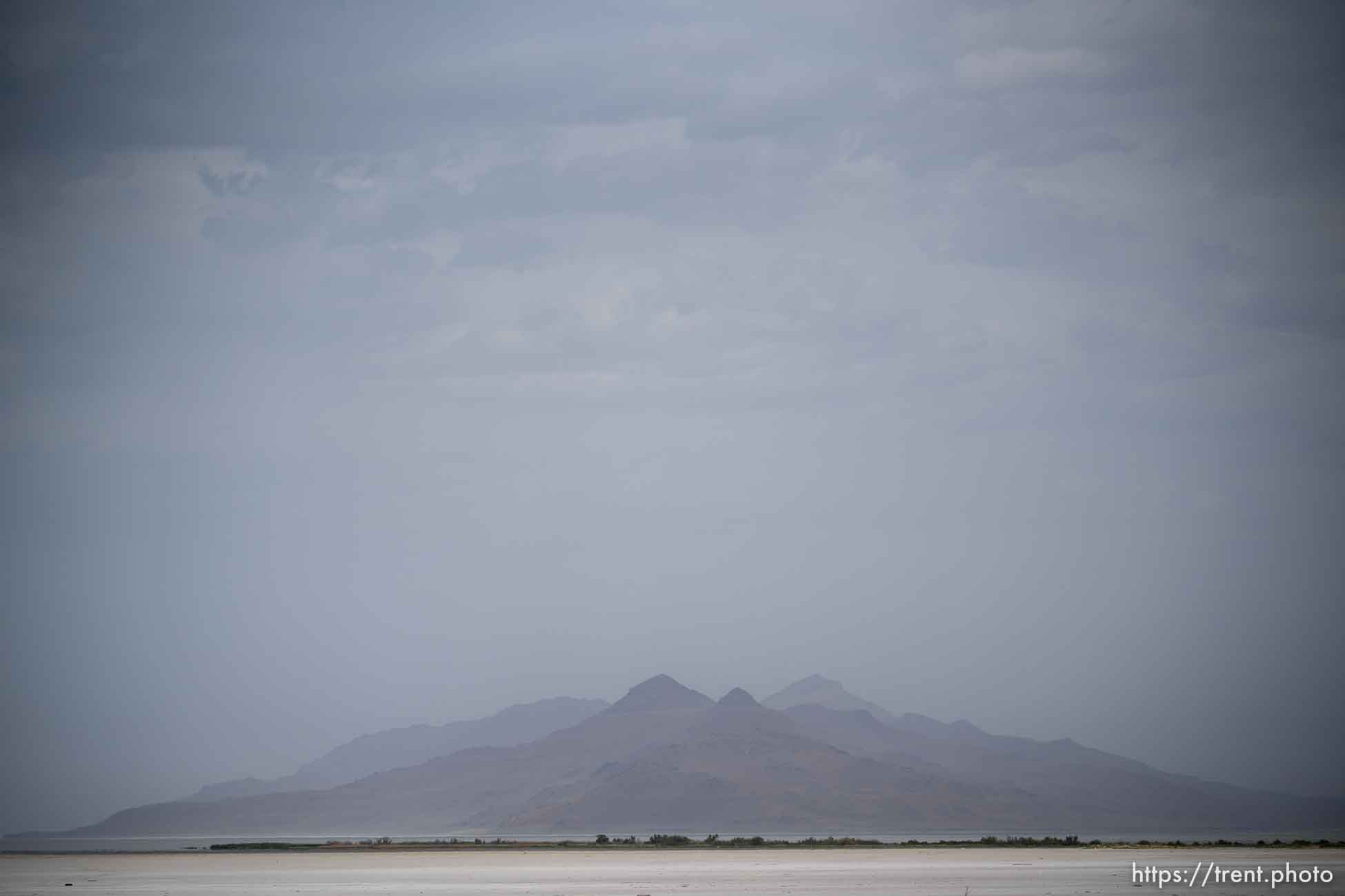 (Trent Nelson  |  The Salt Lake Tribune) Dust obscures Antelope Island and the Great Salt Lake on Saturday, June 18, 2022.