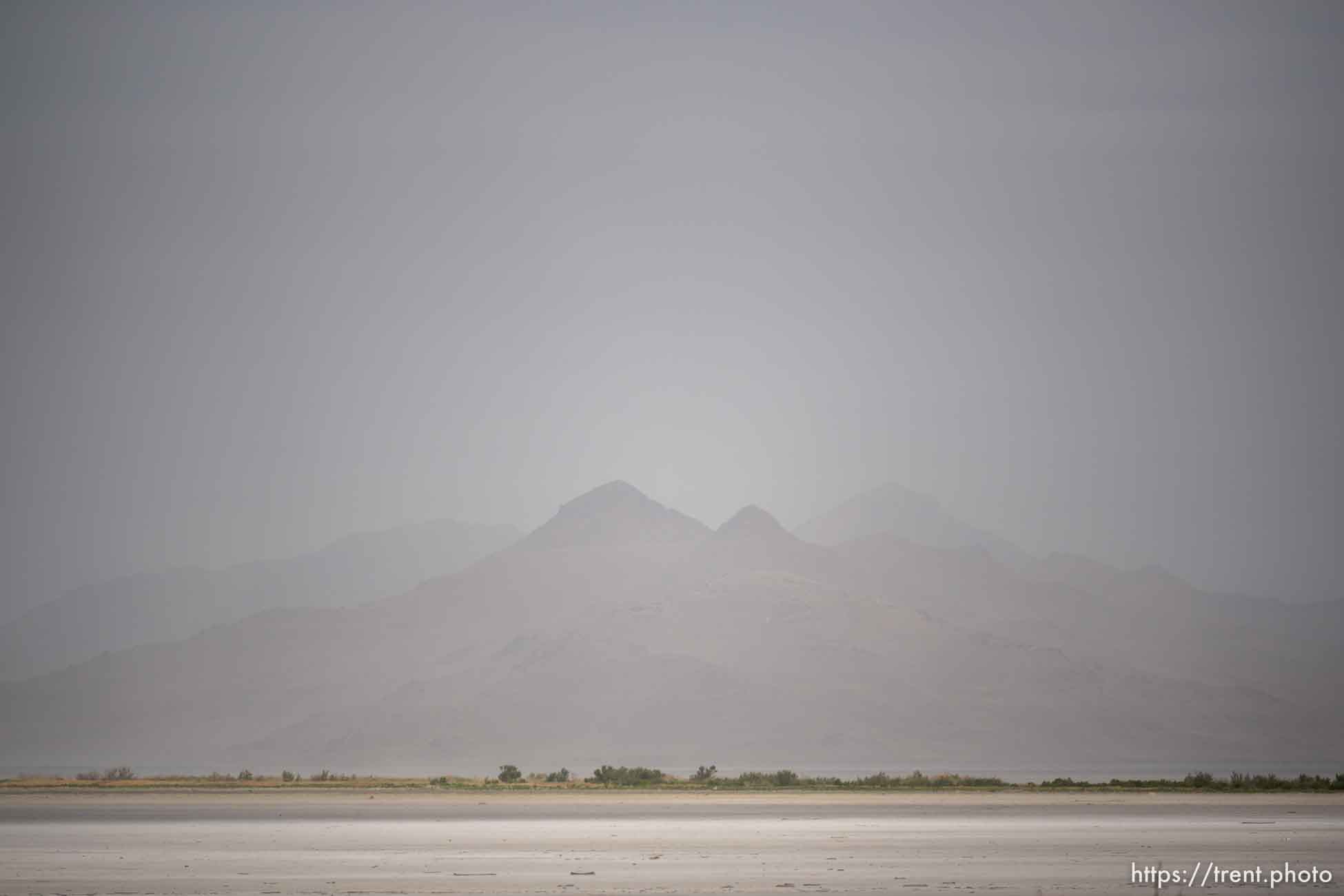 (Trent Nelson  |  The Salt Lake Tribune) Dust obscures Antelope Island and the Great Salt Lake on Saturday, June 18, 2022.