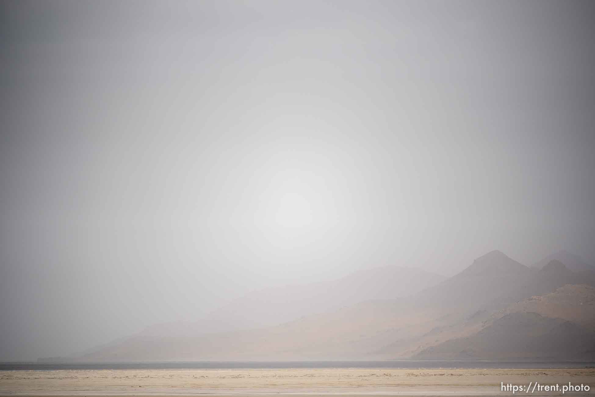 (Trent Nelson  |  The Salt Lake Tribune) Dust obscures Antelope Island and the Great Salt Lake on Saturday, June 18, 2022.