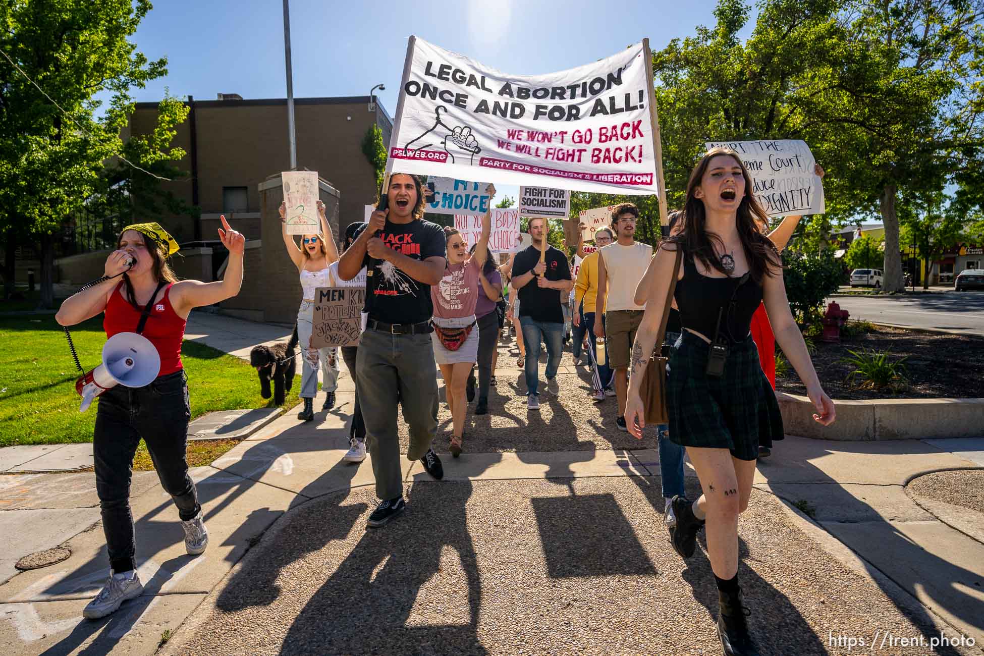 (Trent Nelson  |  The Salt Lake Tribune) People march through downtown Provo, protesting after the U.S. Supreme Court overruled Roe v. Wade, on Saturday, June 25, 2022.