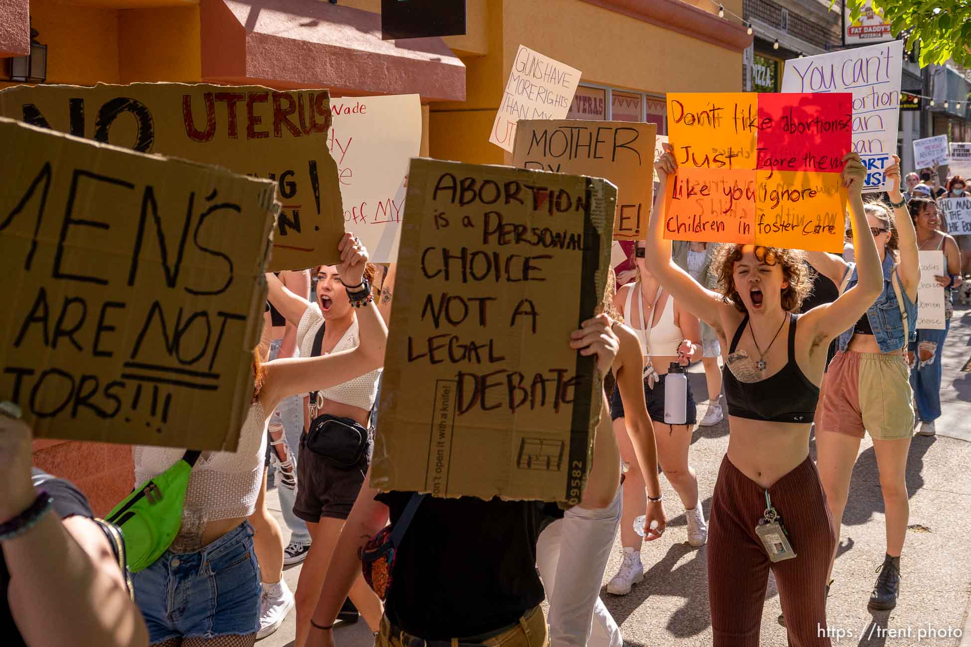 (Trent Nelson  |  The Salt Lake Tribune) People march through downtown Provo, protesting after the U.S. Supreme Court overruled Roe v. Wade, on Saturday, June 25, 2022.