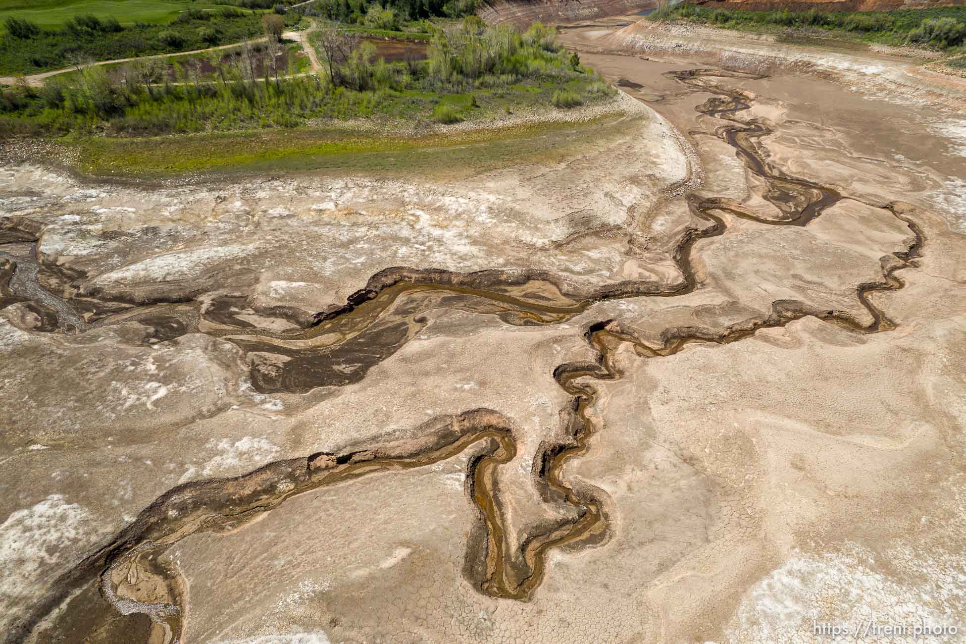 (Trent Nelson | The Salt Lake Tribune) Water trickles through Mountain Dell Reservoir on Wednesday, May 18, 2022.