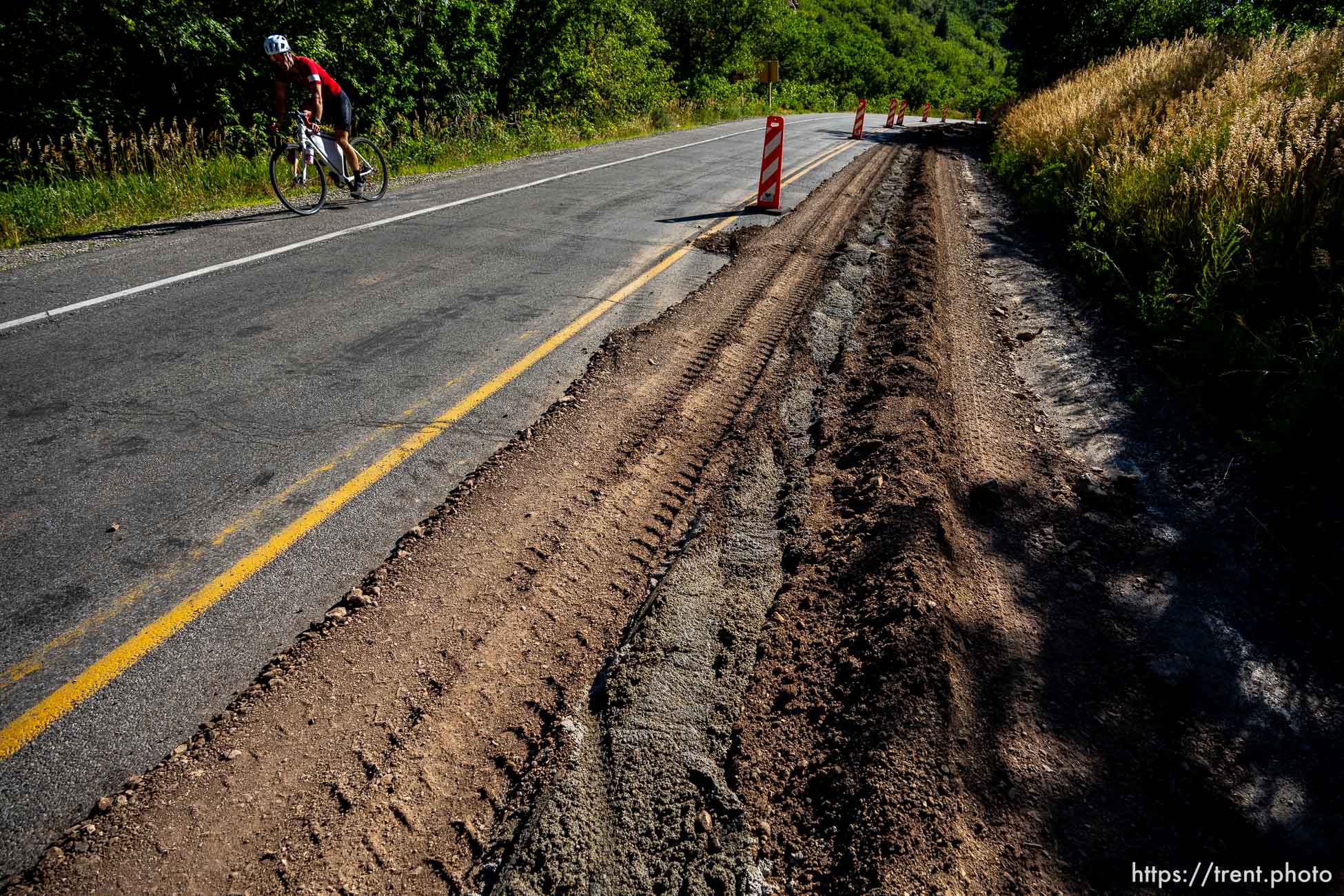 (Trent Nelson  |  The Salt Lake Tribune) Asphalt work has a lane closed in Lower Millcreek Canyon in Salt Lake City on Tuesday, July 26, 2022.