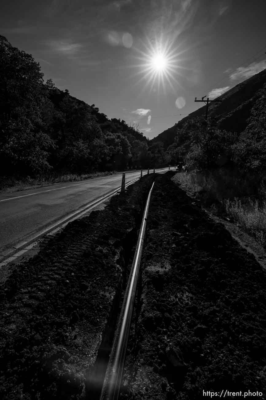 (Trent Nelson  |  The Salt Lake Tribune) Asphalt work has a lane closed in Lower Millcreek Canyon in Salt Lake City on Tuesday, July 26, 2022.