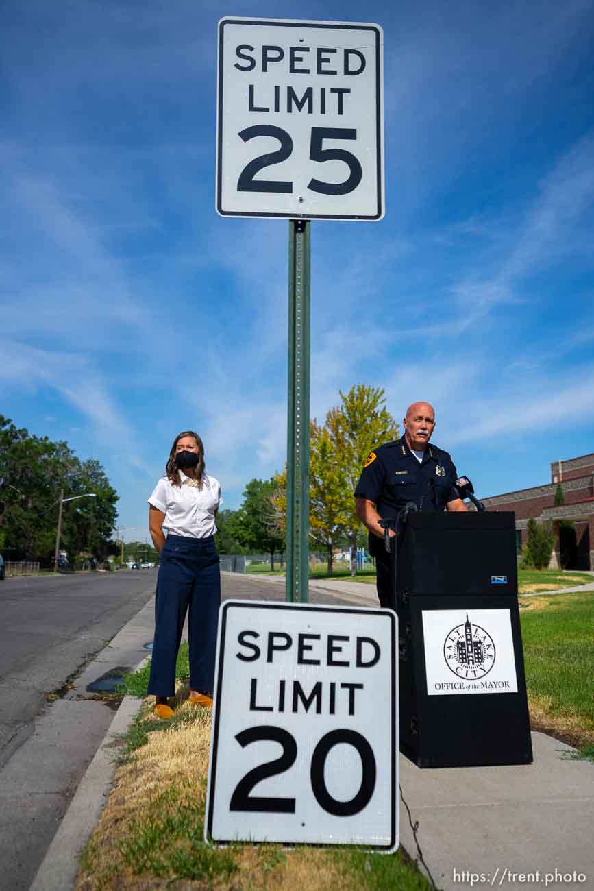 (Trent Nelson  |  The Salt Lake Tribune) Mayor Erin Mendenhall and Police Chief Mike Brown prepare to swap out a 25 mph speed limit sign for a new 20 mph sign, in Salt Lake City on Wednesday, July 27, 2022.