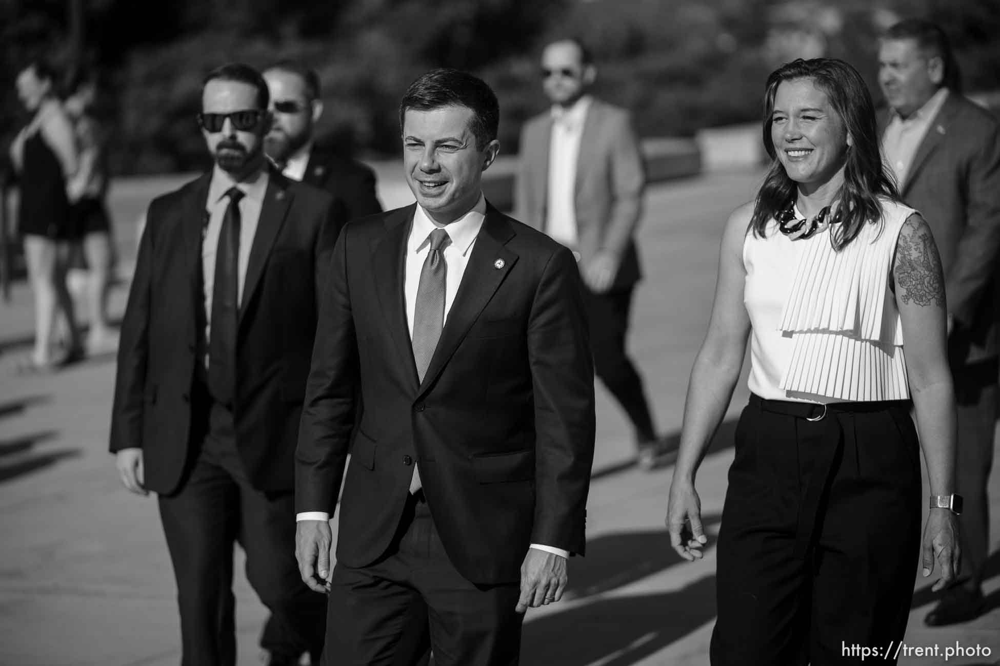 (Trent Nelson  |  The Salt Lake Tribune) Transportation Secretary Pete Buttigieg arrives at a news conference at the State Capitol in Salt Lake City on Friday, July 29, 2022. At right is Mayor Erin Mendenhall.