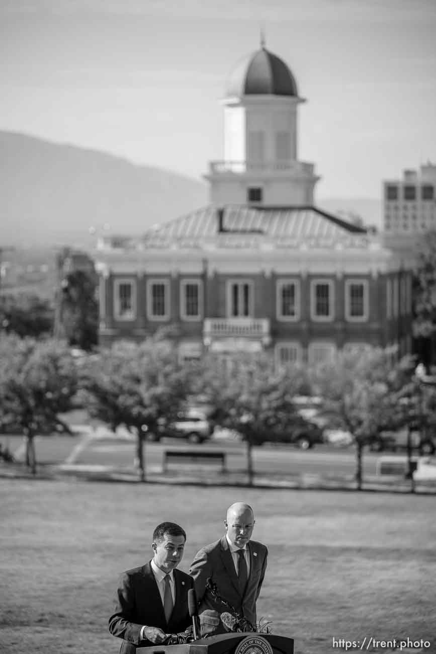 (Trent Nelson  |  The Salt Lake Tribune) Transportation Secretary Pete Buttigieg and Gov. Spencer Cox at a news conference at the State Capitol in Salt Lake City on Friday, July 29, 2022.