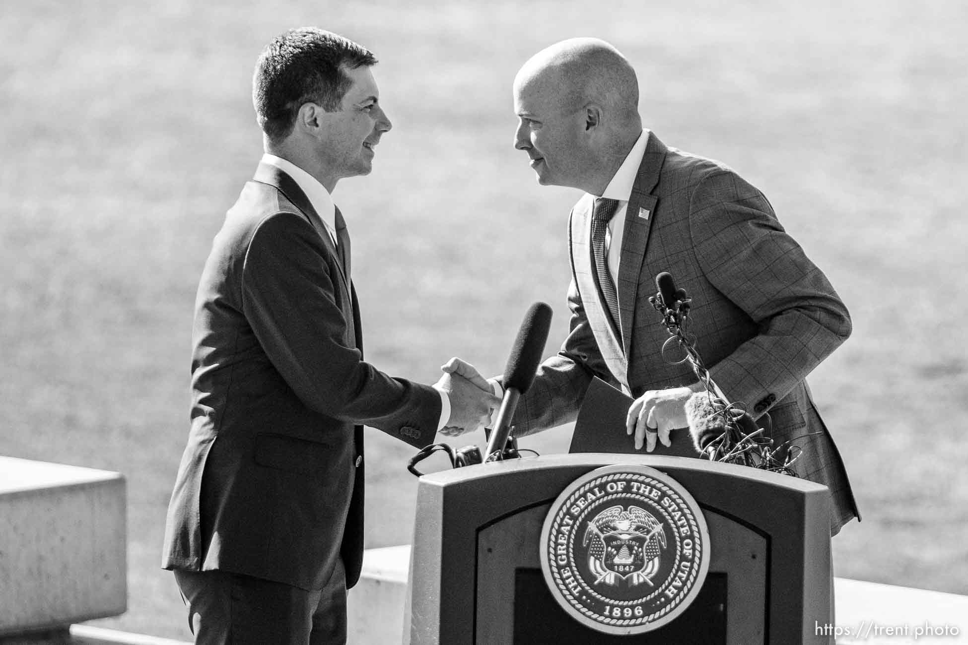 (Trent Nelson  |  The Salt Lake Tribune) Transportation Secretary Pete Buttigieg and Gov. Spencer Cox at a news conference at the State Capitol in Salt Lake City on Friday, July 29, 2022.