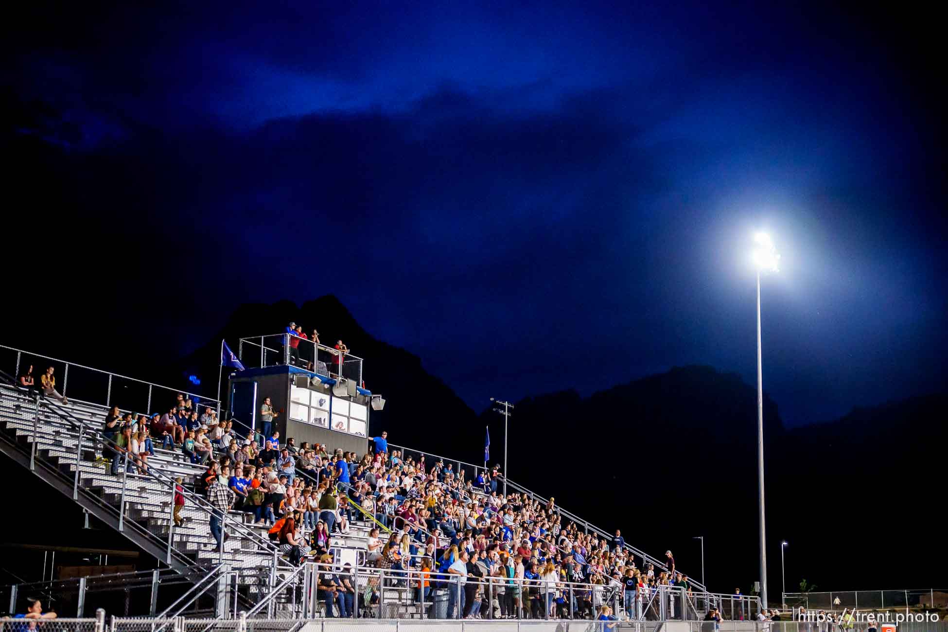 (Trent Nelson  |  The Salt Lake Tribune) Despite their home team trailing 0-50 in their first-ever football game, Water Canyon High School fans stick around until the final buzzer, in Hildale on Friday, Aug. 12, 2022.