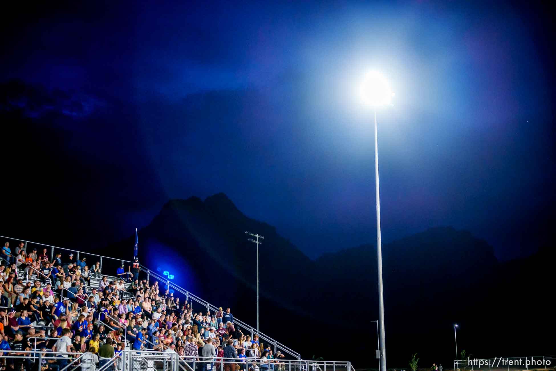 (Trent Nelson  |  The Salt Lake Tribune) Despite their home team trailing 0-50 in their first-ever football game, Water Canyon High School fans stick around until the final buzzer, in Hildale on Friday, Aug. 12, 2022.