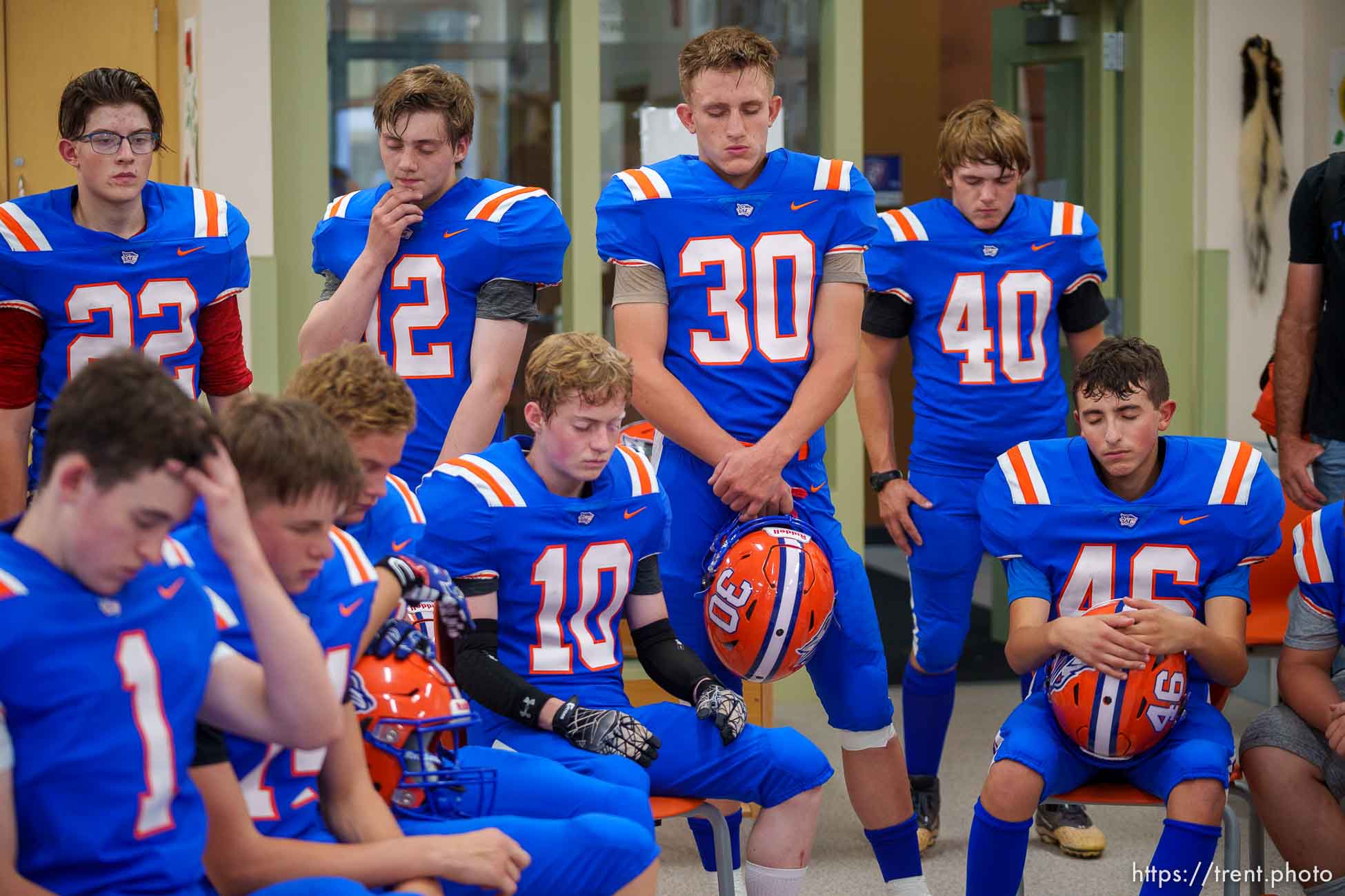 (Trent Nelson  |  The Salt Lake Tribune) Players focus before Water Canyon High School's first football game, in Hildale on Friday, Aug. 12, 2022.