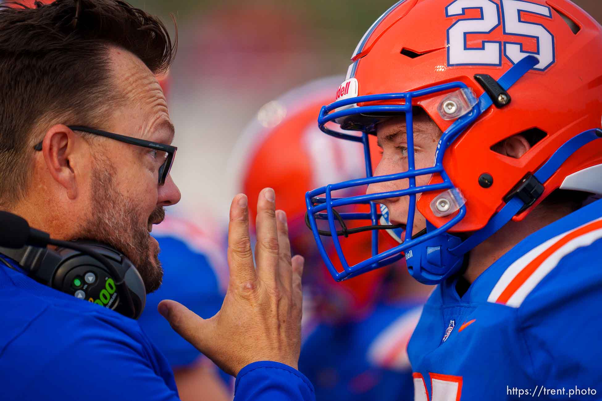 (Trent Nelson  |  The Salt Lake Tribune) Water Canyon High School's Heber Horsley coaches David Barlow during the team's first game, against Grand County, in Hildale on Friday, Aug. 12, 2022.