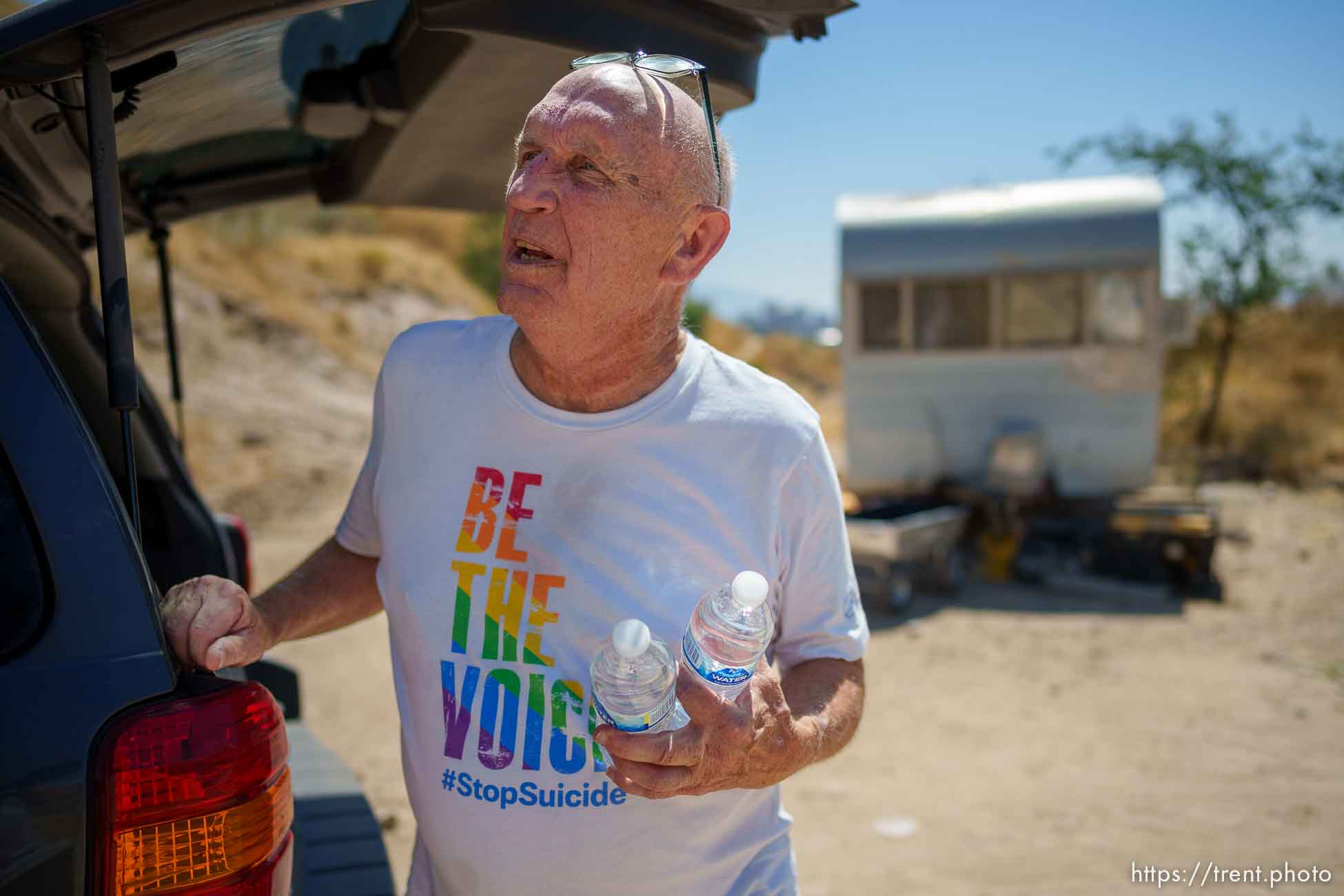 (Trent Nelson  |  The Salt Lake Tribune) Robin Pendergrast delivers water to people living on “the mountain”, in Salt Lake City on Monday, Aug. 29, 2022.