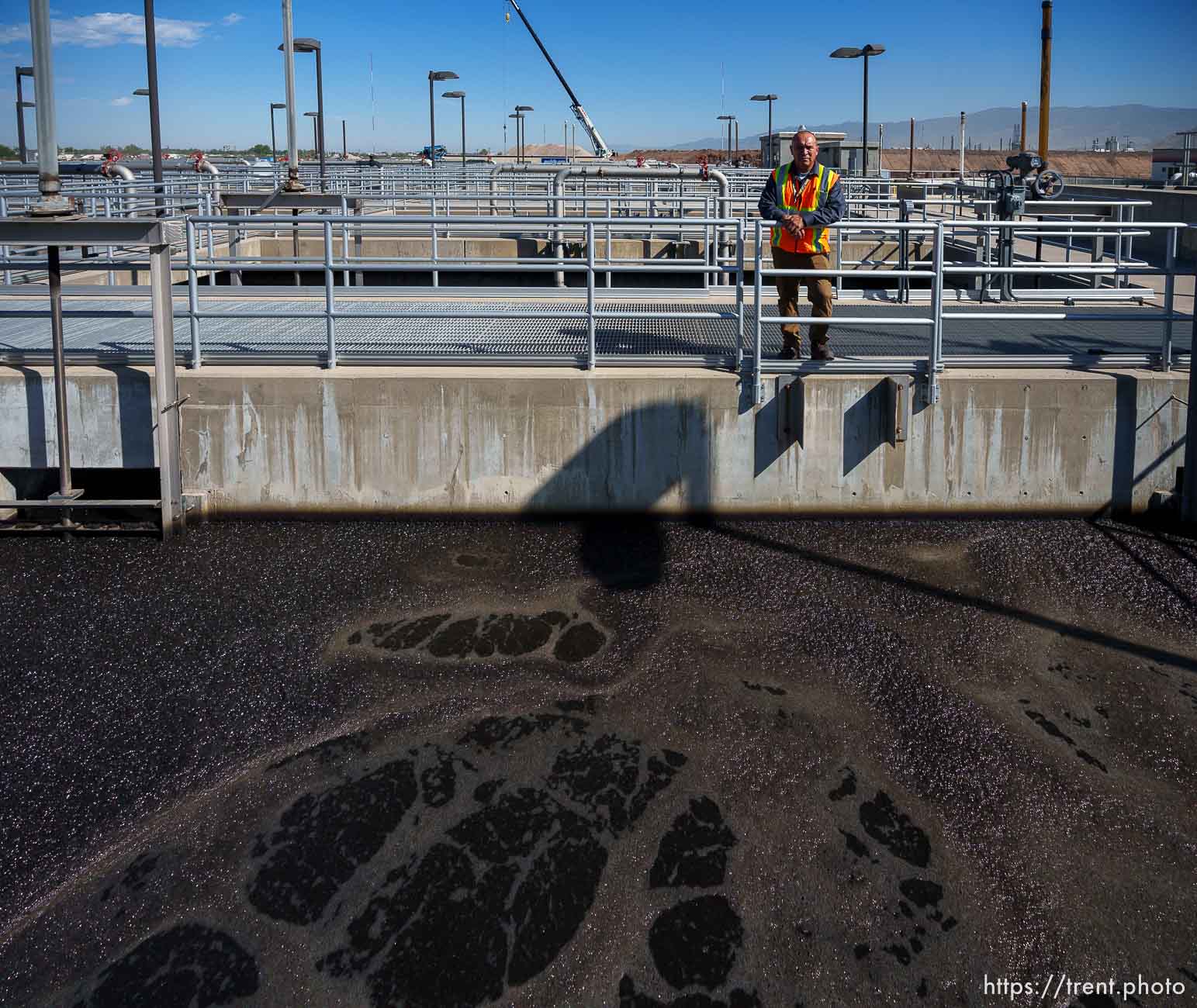 (Trent Nelson  |  The Salt Lake Tribune) Jose Rubalcaba, operations manager overlooking aeration basins at Salt Lake City Public Utilities' Water Reclamation Facility on Tuesday, Aug. 30, 2022.