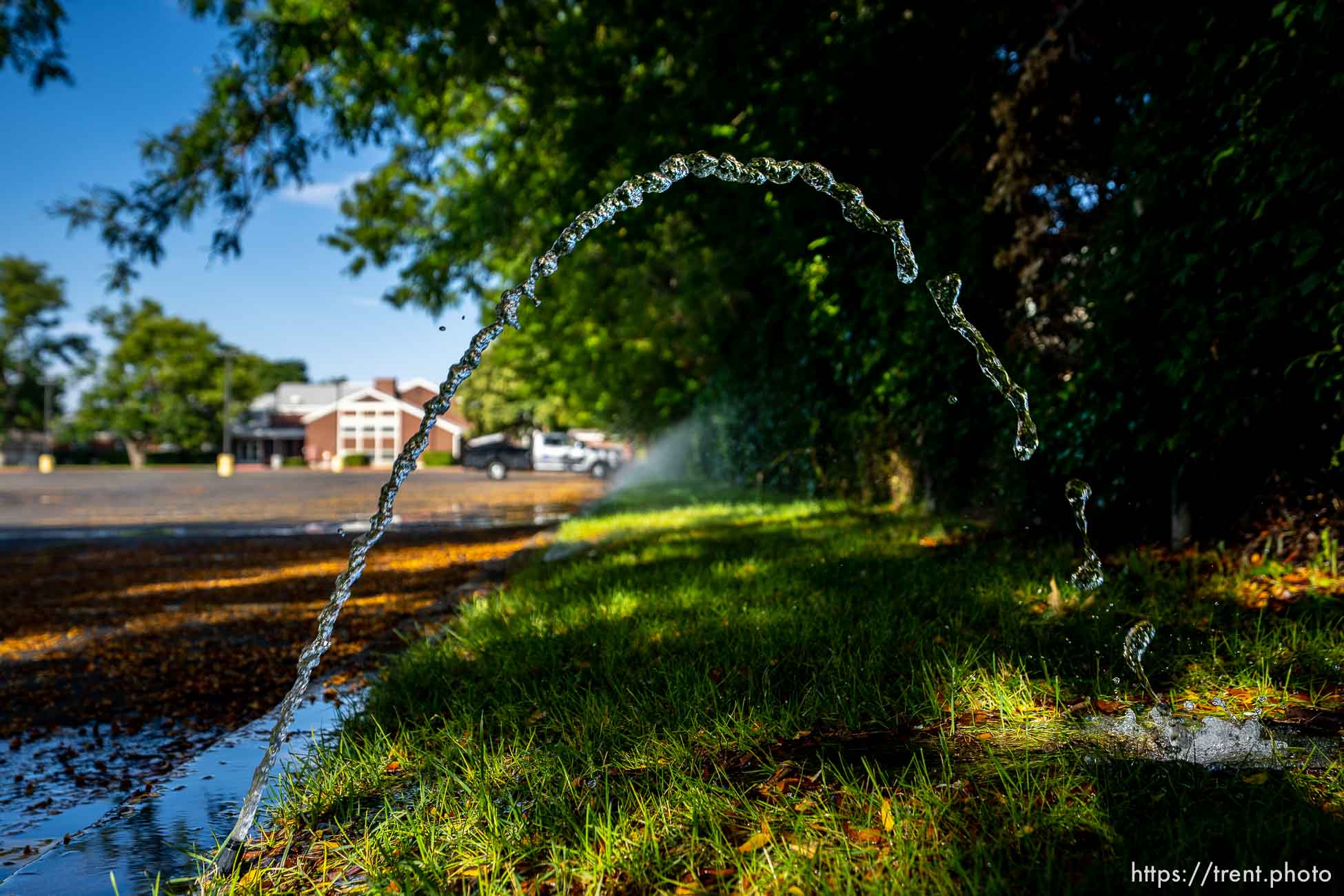 sprinklers at an LDS chapel in Salt Lake City on Thursday, Sept. 8, 2022.