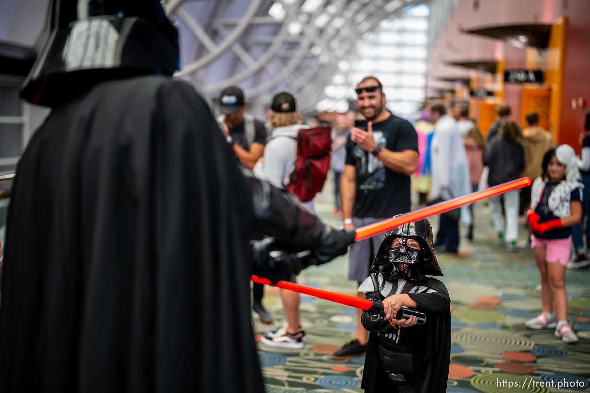 (Trent Nelson  |  The Salt Lake Tribune) A young Darth Vader (Weston Charleson) takes on his older self at FanX Salt Lake Comic Convention on Thursday, Sept. 22, 2022.