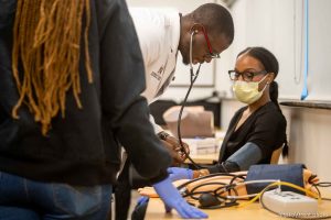 (Trent Nelson  |  The Salt Lake Tribune) Medical student Jude Emego demonstrates taking blood pressure at the first ever Medicine Immersion Day at Alta View Hospital in Sandy on Saturday, Sept. 24, 2022. Intermountain Healthcare and Black Physicians of Utah put on the event to benefit students of color from communities across the state.