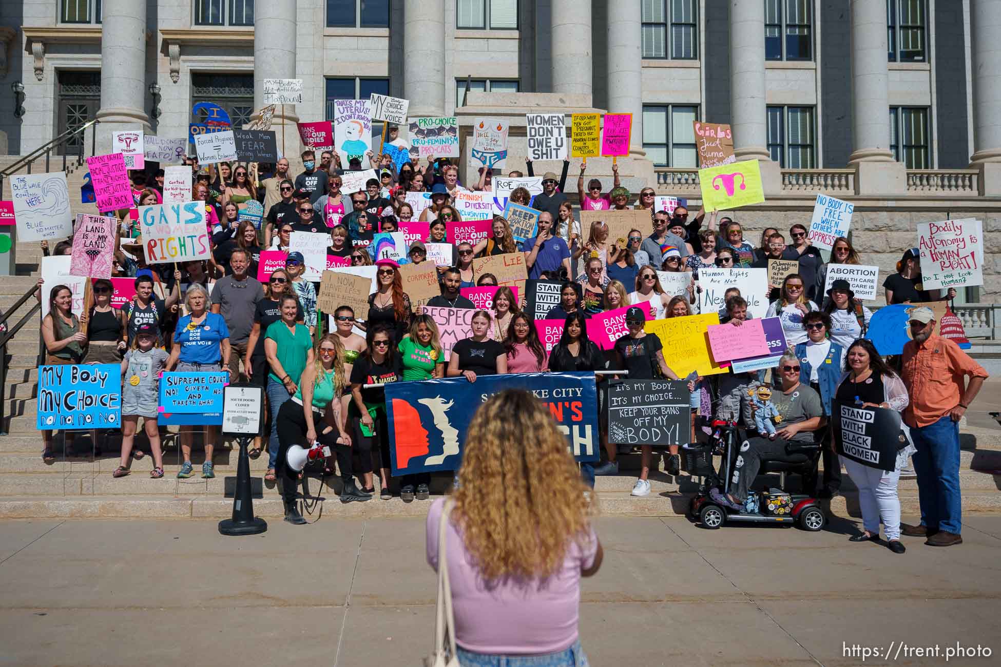 (Trent Nelson  |  The Salt Lake Tribune) People pose for a photo after a rally and march at the State Capitol in Salt Lake City in support of abortion rights on Saturday, Oct. 8, 2022.