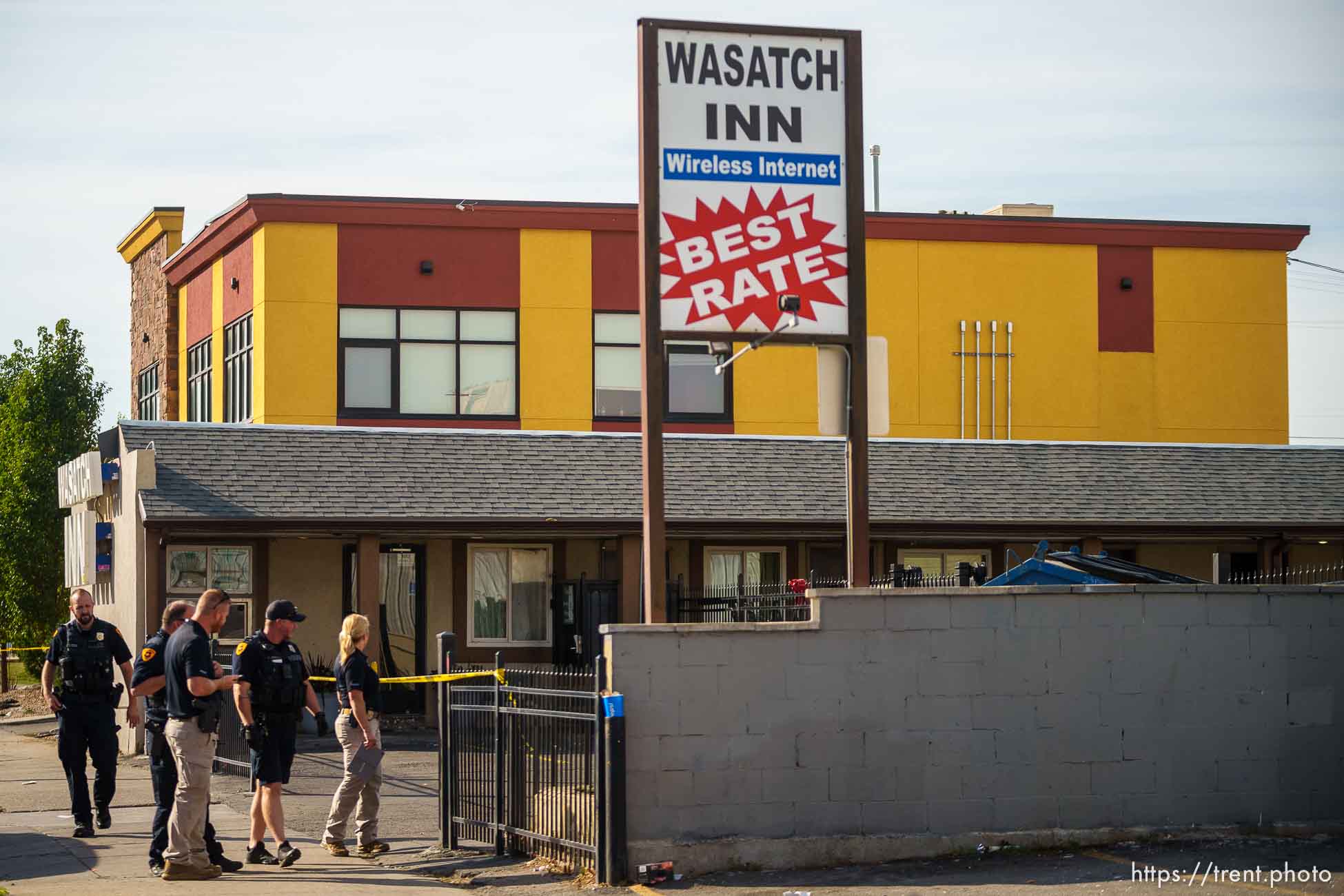 (Trent Nelson  |  The Salt Lake Tribune) Police at the scene of a shooting at Wasatch Inn, on State Street in the Ballpark neighborhood of Salt Lake City on Tuesday, Oct. 11, 2022.