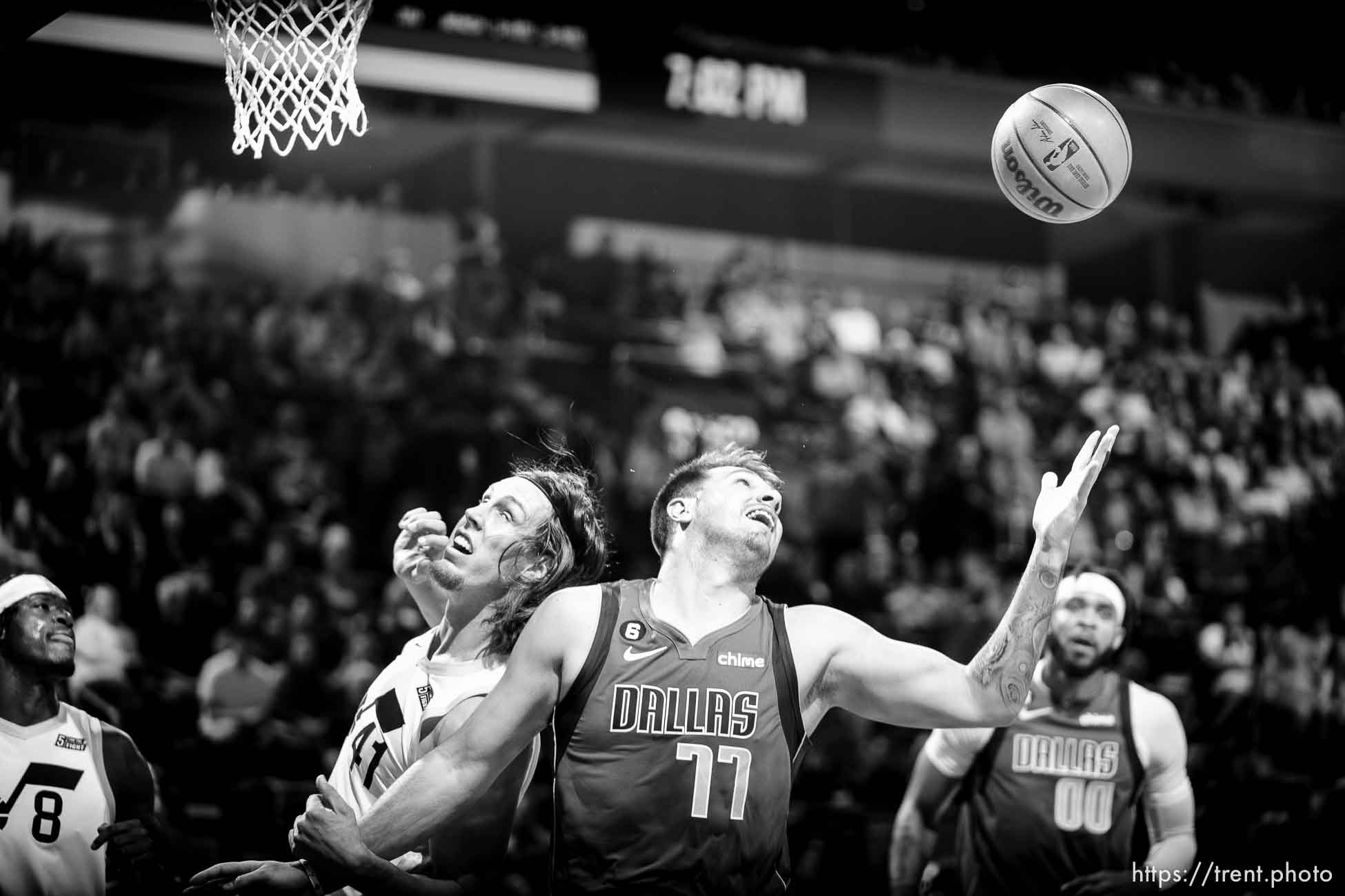 (Trent Nelson  |  The Salt Lake Tribune) Dallas Mavericks guard Luka Doncic (77) pulls in a rebound as the Utah Jazz host the Dallas Mavericks, NBA preseason basketball in Salt Lake City on Friday, Oct. 14, 2022. At left is Utah Jazz forward Kelly Olynyk (41).