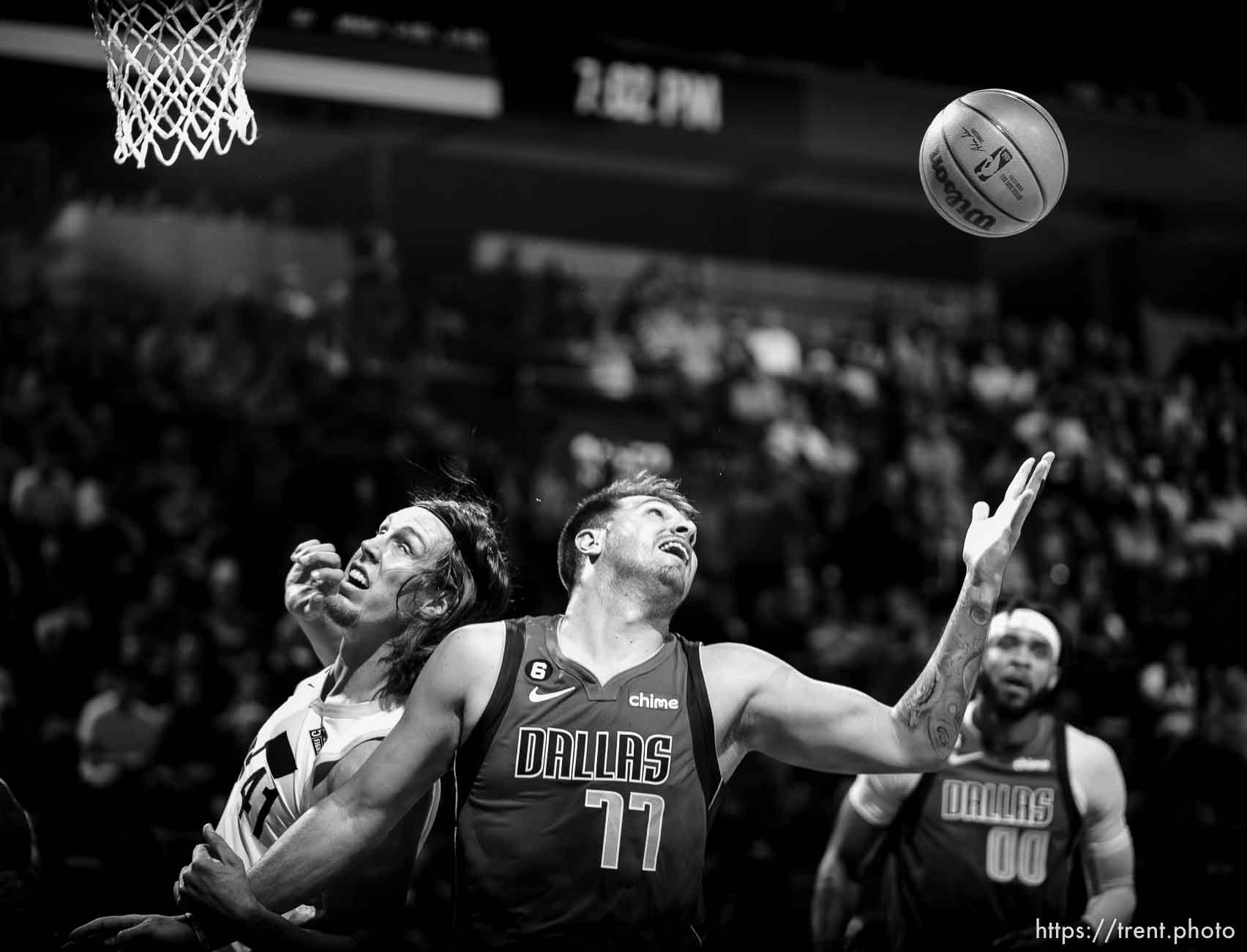 (Trent Nelson  |  The Salt Lake Tribune) Dallas Mavericks guard Luka Doncic (77) pulls in a rebound as the Utah Jazz host the Dallas Mavericks, NBA preseason basketball in Salt Lake City on Friday, Oct. 14, 2022. At left is Utah Jazz forward Kelly Olynyk (41).