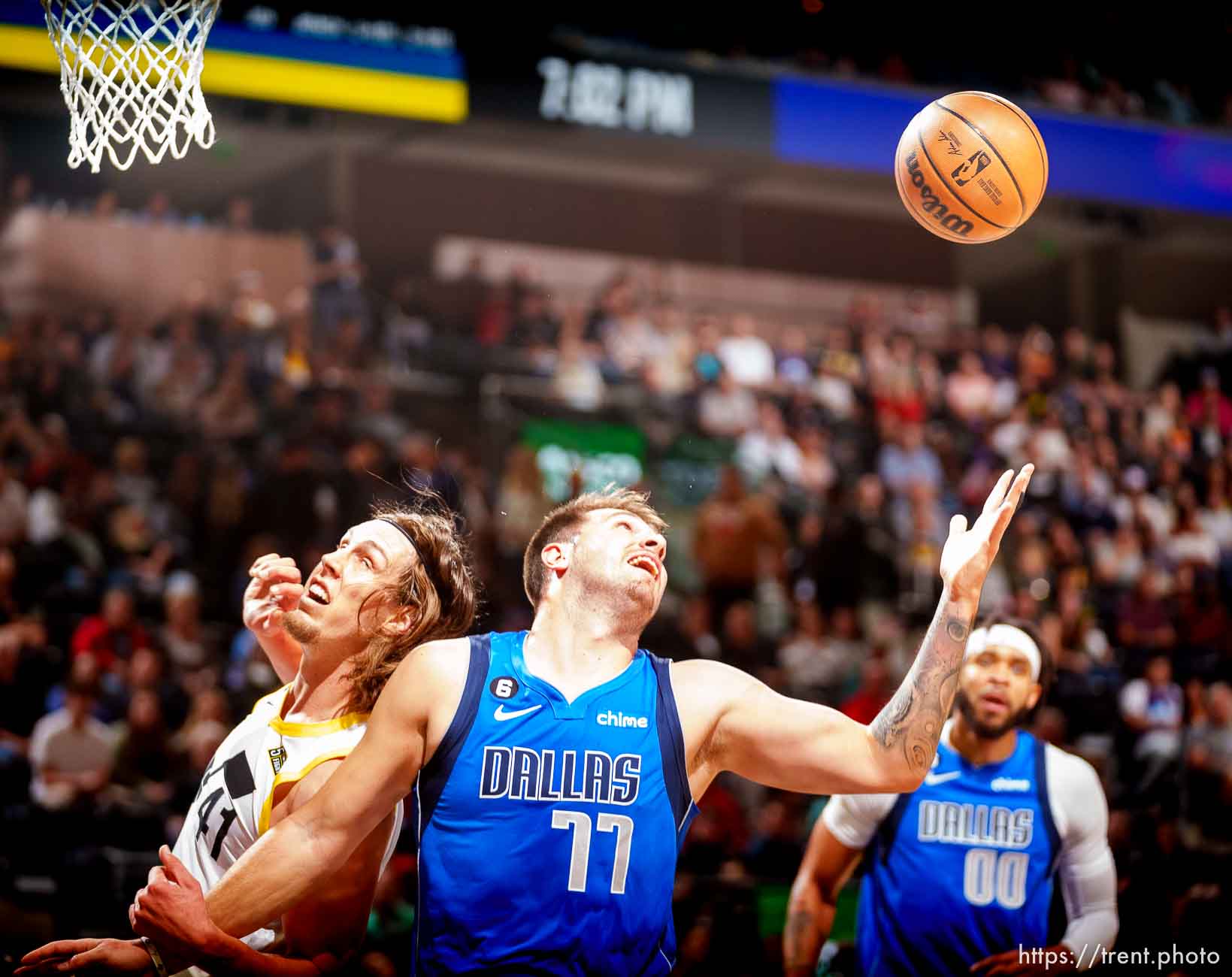 (Trent Nelson  |  The Salt Lake Tribune) Dallas Mavericks guard Luka Doncic (77) pulls in a rebound as the Utah Jazz host the Dallas Mavericks, NBA preseason basketball in Salt Lake City on Friday, Oct. 14, 2022. At left is Utah Jazz forward Kelly Olynyk (41).