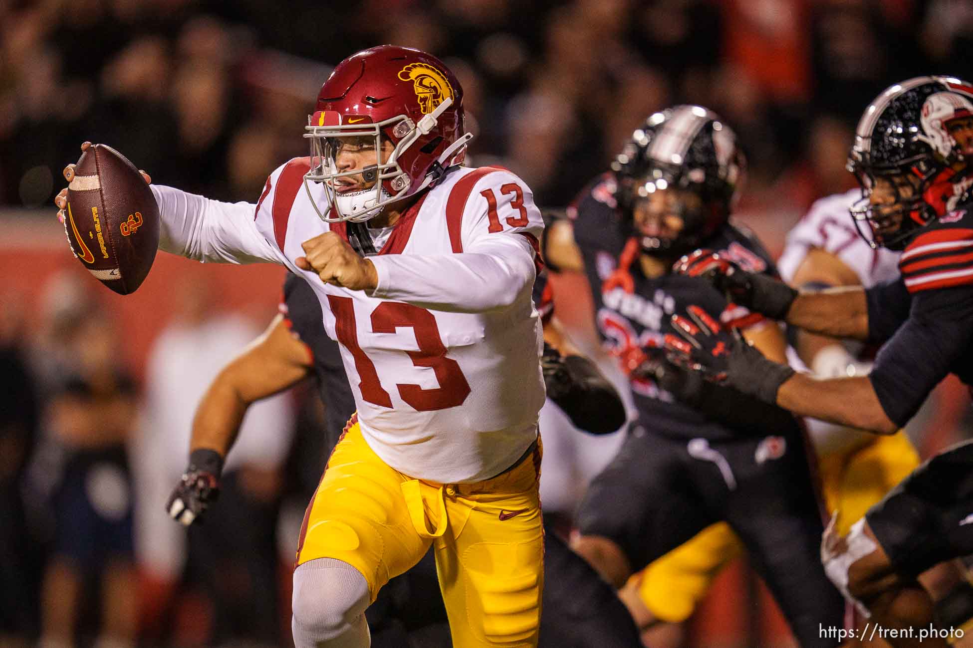 (Trent Nelson  |  The Salt Lake Tribune) USC Trojans quarterback Caleb Williams (13) scrambles for a first down as the University of Utah hosts USC, NCAA football in Salt Lake City on Saturday, Oct. 15, 2022.