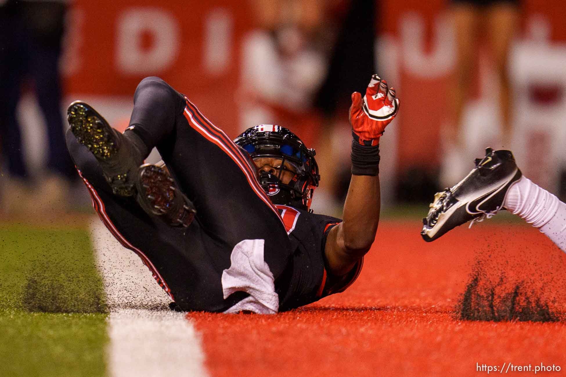 (Trent Nelson  |  The Salt Lake Tribune) Utah Utes wide receiver Money Parks (10) slides into the end zone after catching a pass as the University of Utah hosts USC, NCAA football in Salt Lake City on Saturday, Oct. 15, 2022.