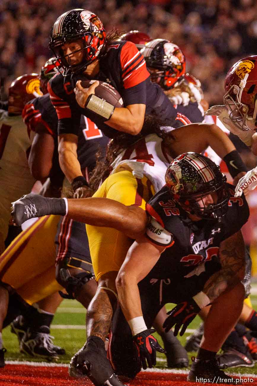 (Trent Nelson  |  The Salt Lake Tribune) Utah Utes quarterback Cameron Rising (7) scores a fourth-down touchdown, leading to a two-point conversion to win, as the University of Utah hosts USC, NCAA football in Salt Lake City on Saturday, Oct. 15, 2022.