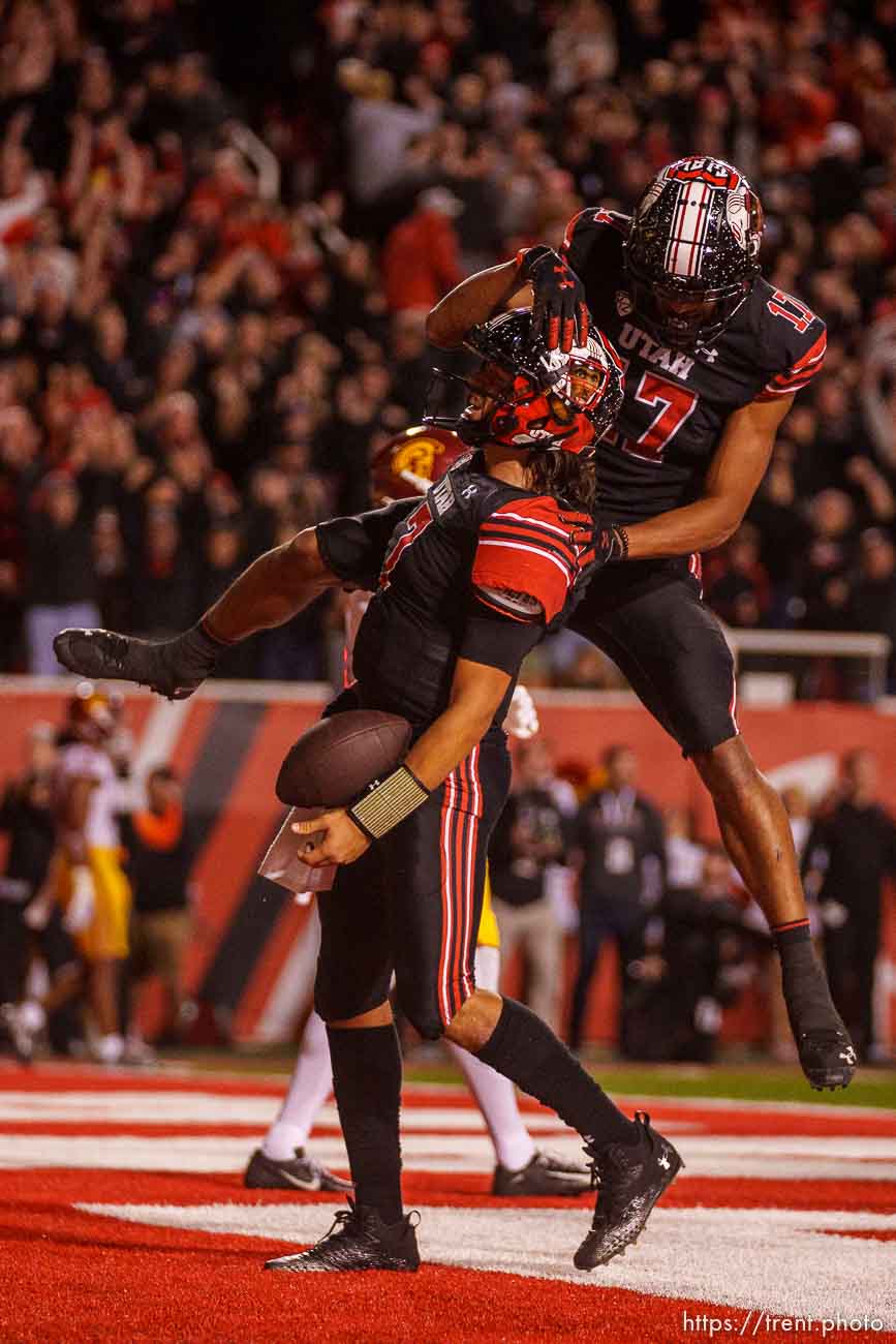 (Trent Nelson  |  The Salt Lake Tribune) Utah Utes quarterback Cameron Rising (7) celebrates a game-winning two-point conversion as the University of Utah hosts USC, NCAA football in Salt Lake City on Saturday, Oct. 15, 2022. Leaping onto Rising is Utah Utes wide receiver Devaughn Vele (17).