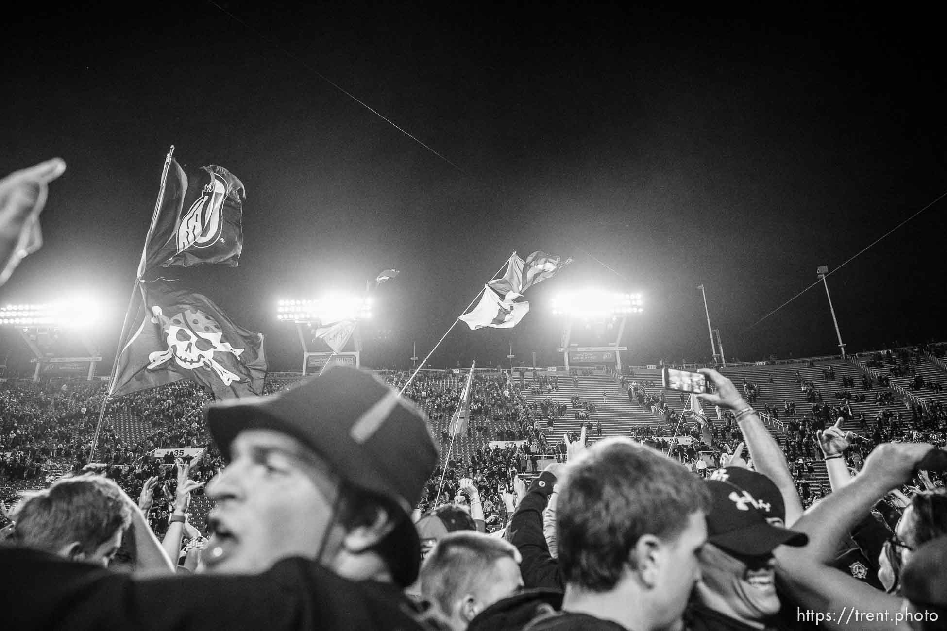 (Trent Nelson  |  The Salt Lake Tribune) Utah fans swarm the field as the University of Utah beats USC 43-42, NCAA football in Salt Lake City on Saturday, Oct. 15, 2022.