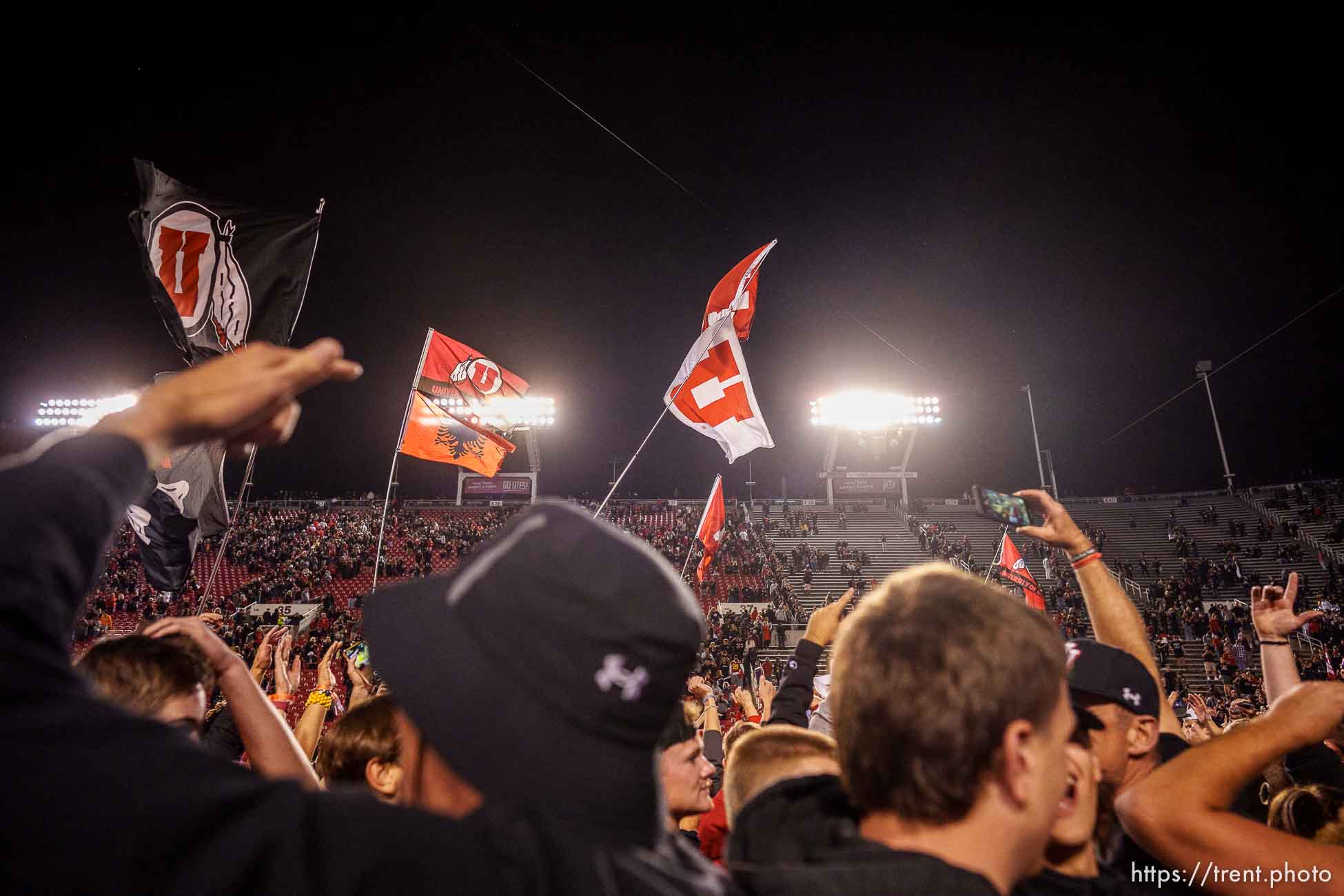 (Trent Nelson  |  The Salt Lake Tribune) Utah fans swarm the field as the University of Utah beats USC 43-42, NCAA football in Salt Lake City on Saturday, Oct. 15, 2022.