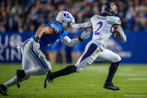 (Trent Nelson  |  The Salt Lake Tribune) East Carolina Pirates running back Keaton Mitchell (2) runs from Brigham Young Cougars linebacker Ben Bywater (2) as BYU hosts East Carolina, NCAA football in Provo on Friday, Oct. 28, 2022.