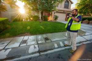 (Trent Nelson  |  The Salt Lake Tribune) Salvador Polanco-Gamez, a conservation aide with the Las Vegas Valley Water District, documents a leak in a sprinkler system in Summerlin, a community in the Las Vegas Valley, Nevada on Thursday, Sept. 29, 2022.