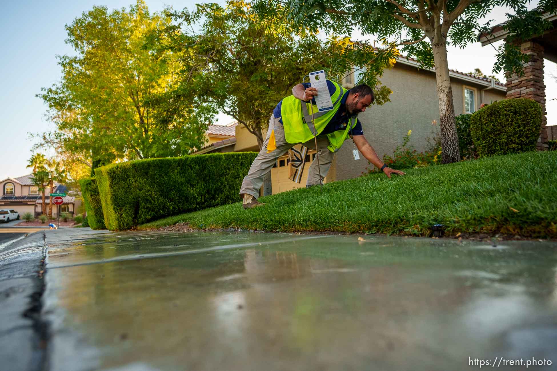 (Trent Nelson  |  The Salt Lake Tribune) Salvador Polanco-Gamez, a conservation aide with the Las Vegas Valley Water District, documents a leak in a sprinkler system in Summerlin, a community in the Las Vegas Valley, Nevada on Thursday, Sept. 29, 2022.