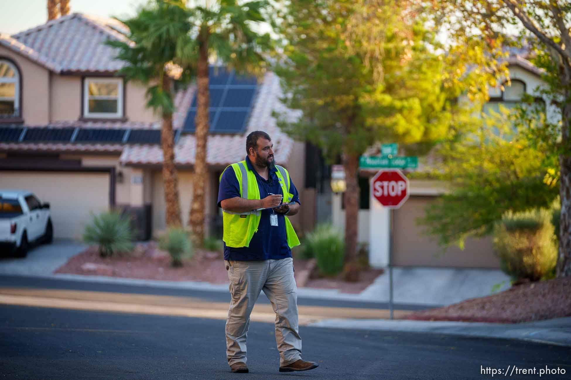 (Trent Nelson  |  The Salt Lake Tribune) Salvador Polanco-Gamez, a conservation aide with the Las Vegas Valley Water District, patrols in Summerlin, a community in the Las Vegas Valley, Nevada on Thursday, Sept. 29, 2022. When runoff water from a home's sprinklers reaches the street, Polanco-Gamez stops to document the situation and notify the homeowner.