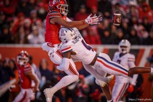 (Trent Nelson  |  The Salt Lake Tribune) Utah Utes wide receiver Devaughn Vele (17) is hit by Arizona Wildcats cornerback Christian Roland-Wallace (4) and can't grab the touchdown pass as the University of Utah hosts Arizona, NCAA football in Salt Lake City on Saturday, Nov. 5, 2022.