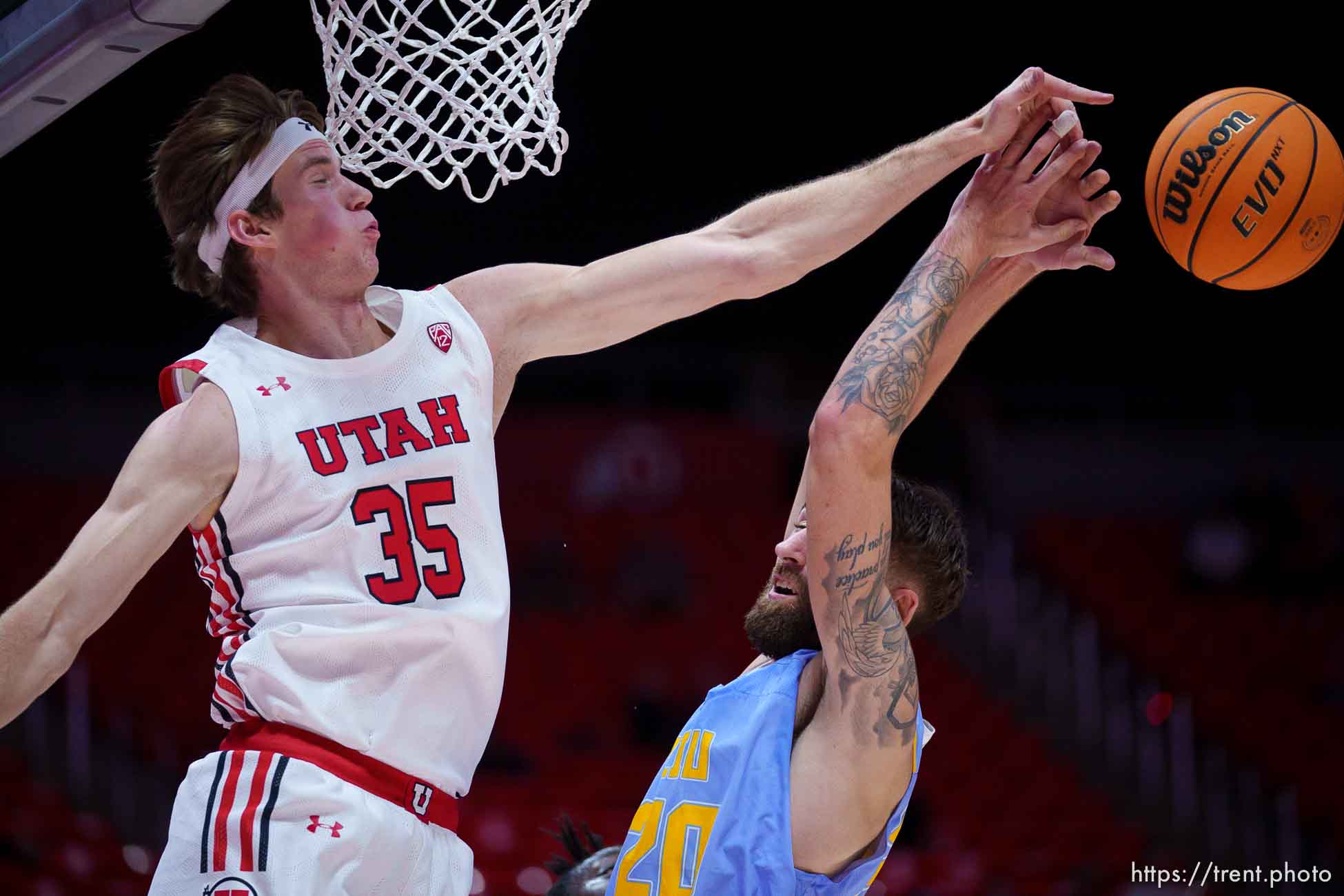 (Trent Nelson  |  The Salt Lake Tribune) Utah Utes center Branden Carlson (35) blocks a shot by Long Island University Sharks forward Jake Cook as the University of Utah hosts Long Island University, NCAA basketball in Salt Lake City on Monday, Nov. 7, 2022.