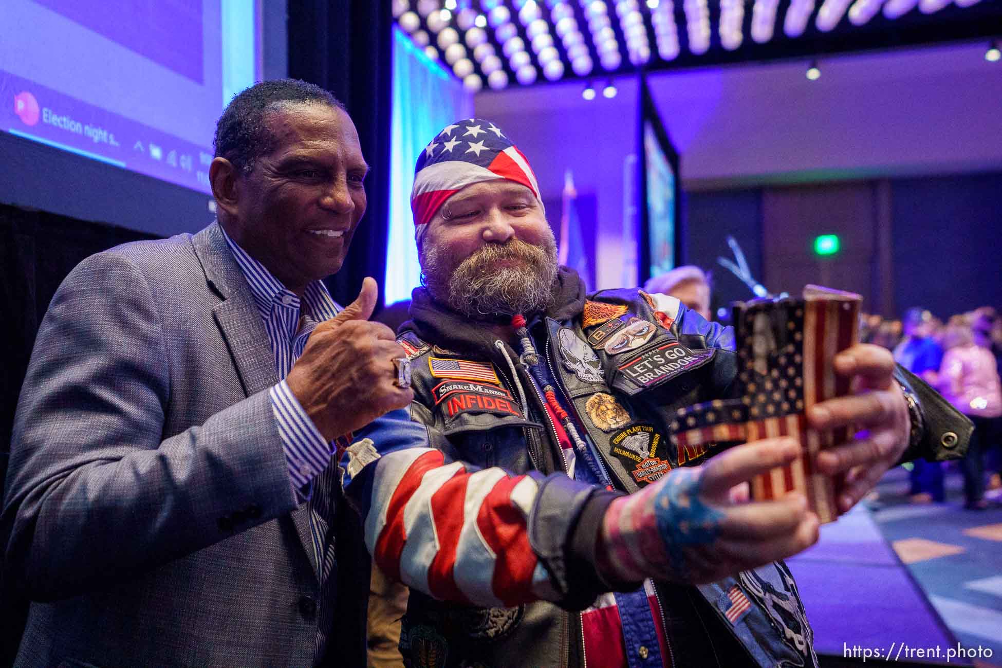 (Trent Nelson  |  The Salt Lake Tribune) Rep. Burgess Owens poses for a selfie with Victor the SnakeMannn at the Utah Republican Party election night party at the Hyatt Regency in Salt Lake City on Tuesday, Nov. 8, 2022.