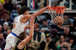 (Trent Nelson  |  The Salt Lake Tribune) New York Knicks center Jericho Sims (45) dunks over Utah Jazz center Walker Kessler (24) as the Utah Jazz host the New York Knicks, NBA basketball in Salt Lake City on Tuesday, Nov. 15, 2022.