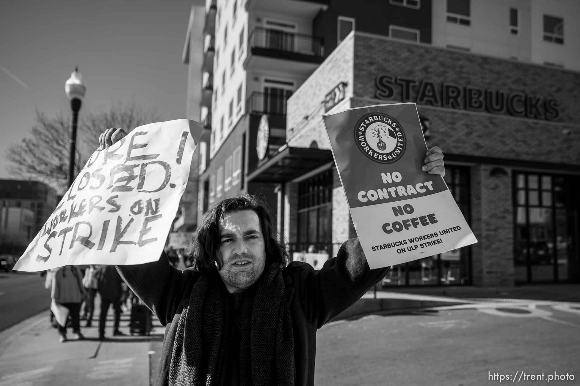 (Trent Nelson  |  The Salt Lake Tribune) Starbucks workers strike in front of 400 South Salt Lake City location as part of Red Cup Rebellion, taking place across the country on Thursday, Nov. 17, 2022. George Metos at center.