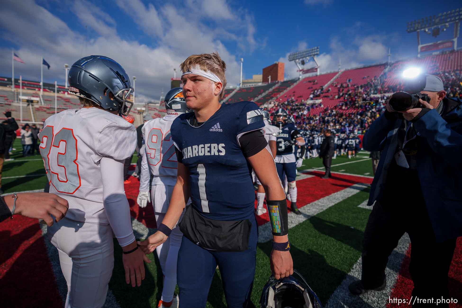 (Trent Nelson  |  The Salt Lake Tribune) Corner Canyon's Isaac Wilson (1) shakes hands with Skyridge players after losing in the 6A high school football championship game at Rice-Eccles Stadium in Salt Lake City on Friday, Nov. 18, 2022.