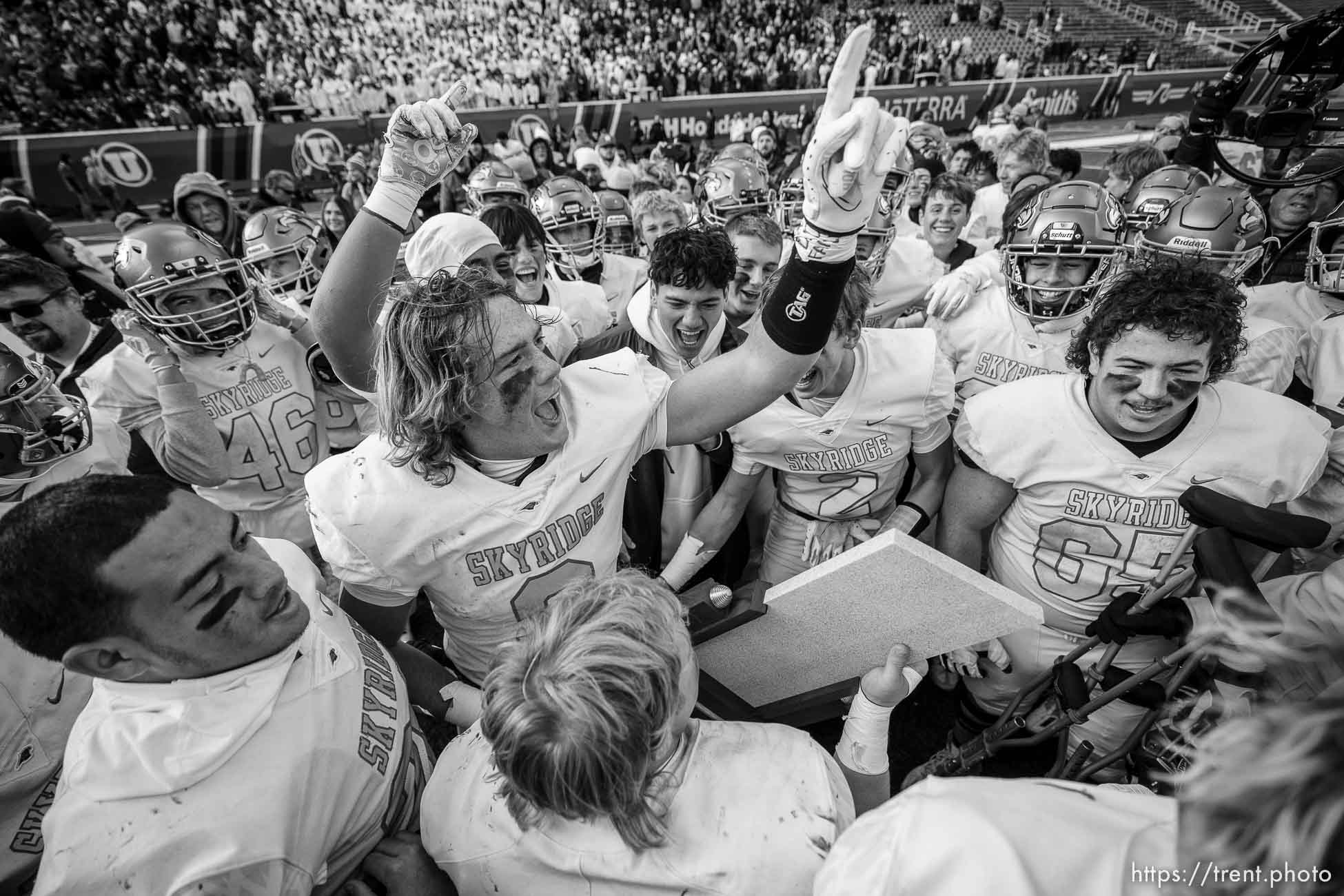 (Trent Nelson  |  The Salt Lake Tribune) Skyridge players celebrate their win over Corner Canyon in the 6A high school football championship game at Rice-Eccles Stadium in Salt Lake City on Friday, Nov. 18, 2022.