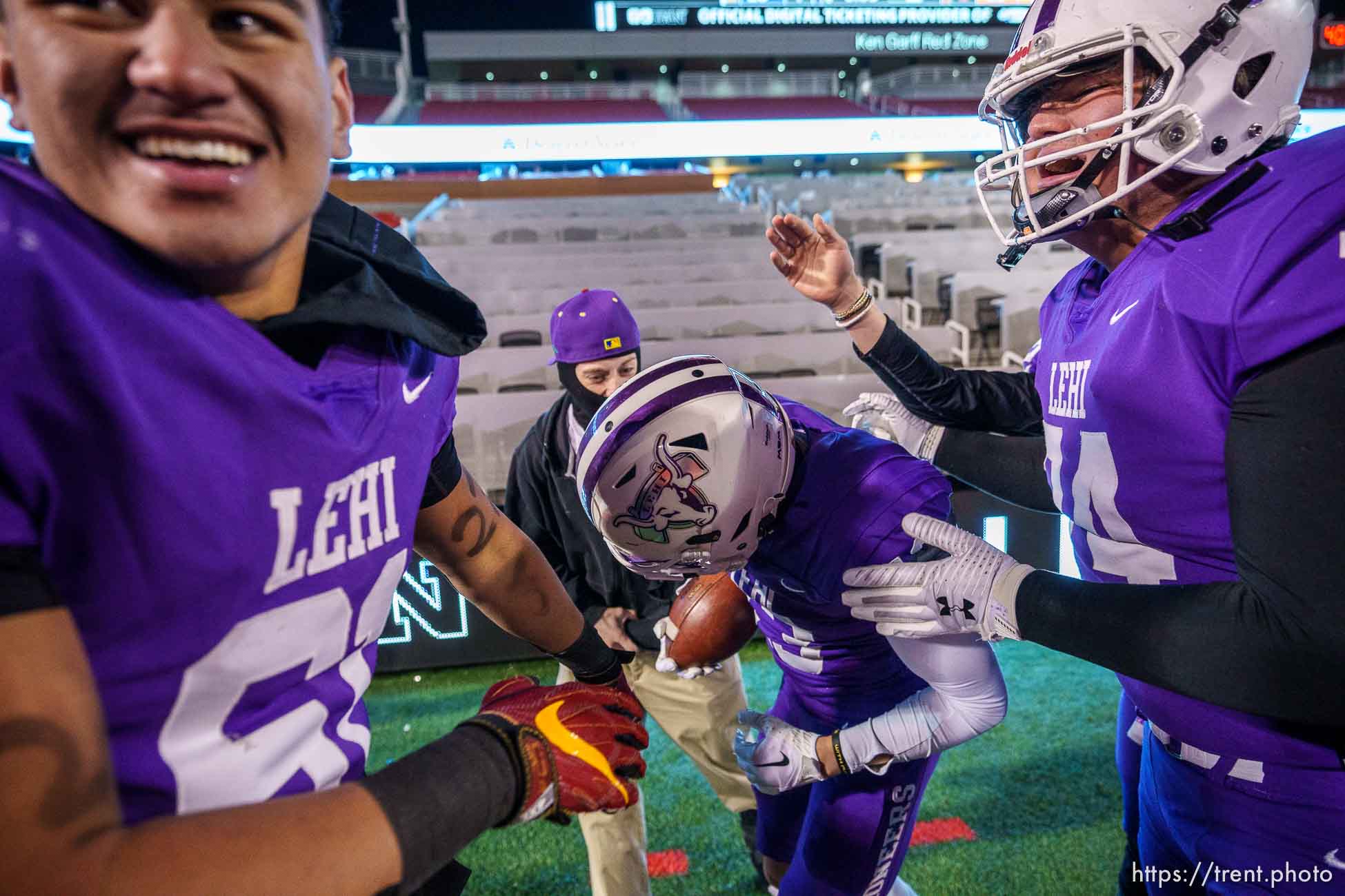 (Trent Nelson  |  The Salt Lake Tribune) Lehi players swarm Lehi's Stockton Cram (13) after his overtime touchdown reception to defeat Timpview in the 5A high school football championship game at Rice-Eccles Stadium in Salt Lake City on Friday, Nov. 18, 2022.